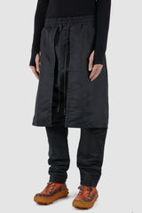 XConcept - Front side view of black front panel trousers.