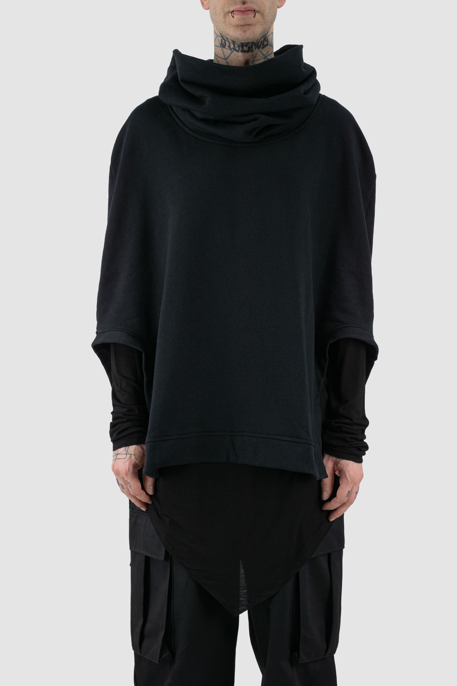 XConcept - Front view of black overlapping shoulder high neck top for men with asymmetrical cut, stand-up collar, thick cotton, FW24 Collection.