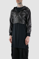 XConcept - Front side view of black hooded jacket made of vegan leather.