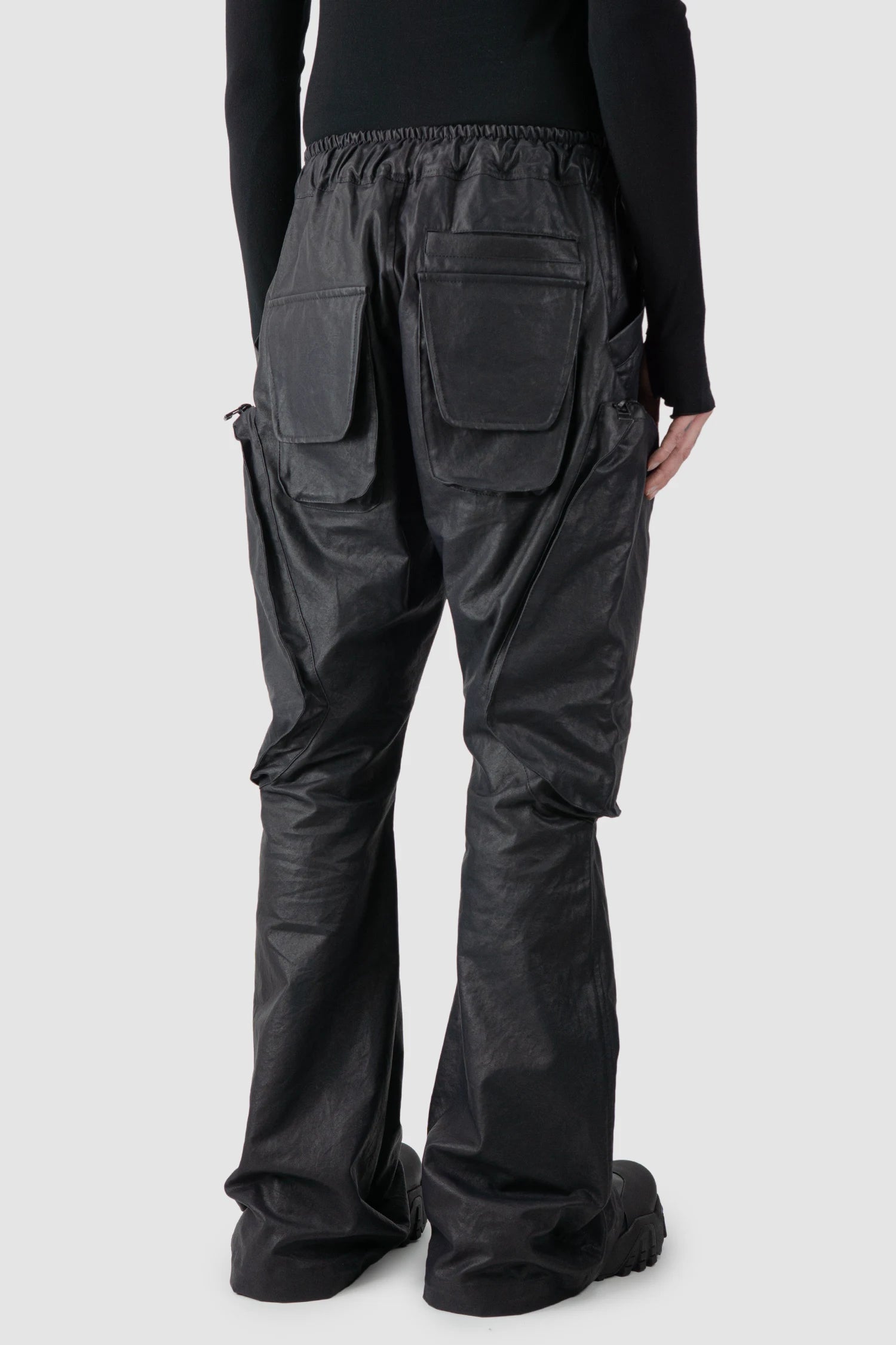 Gall Laboratories by Justin Gall - model back side view of men’s Black Heavy Coated Wide Leg Cargo Trousers