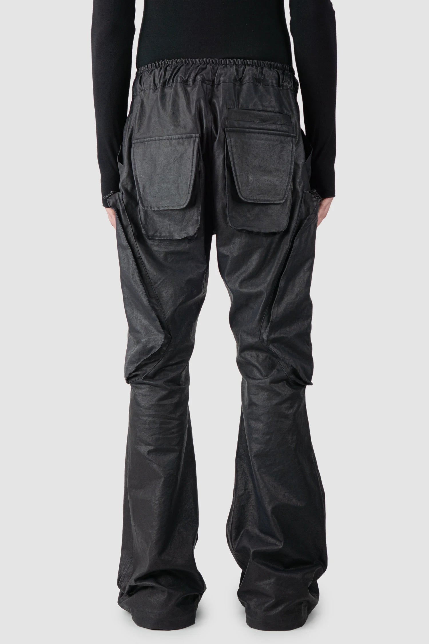 Gall Laboratories by Justin Gall - model back view of men’s Black Heavy Coated Wide Leg Cargo Trousers