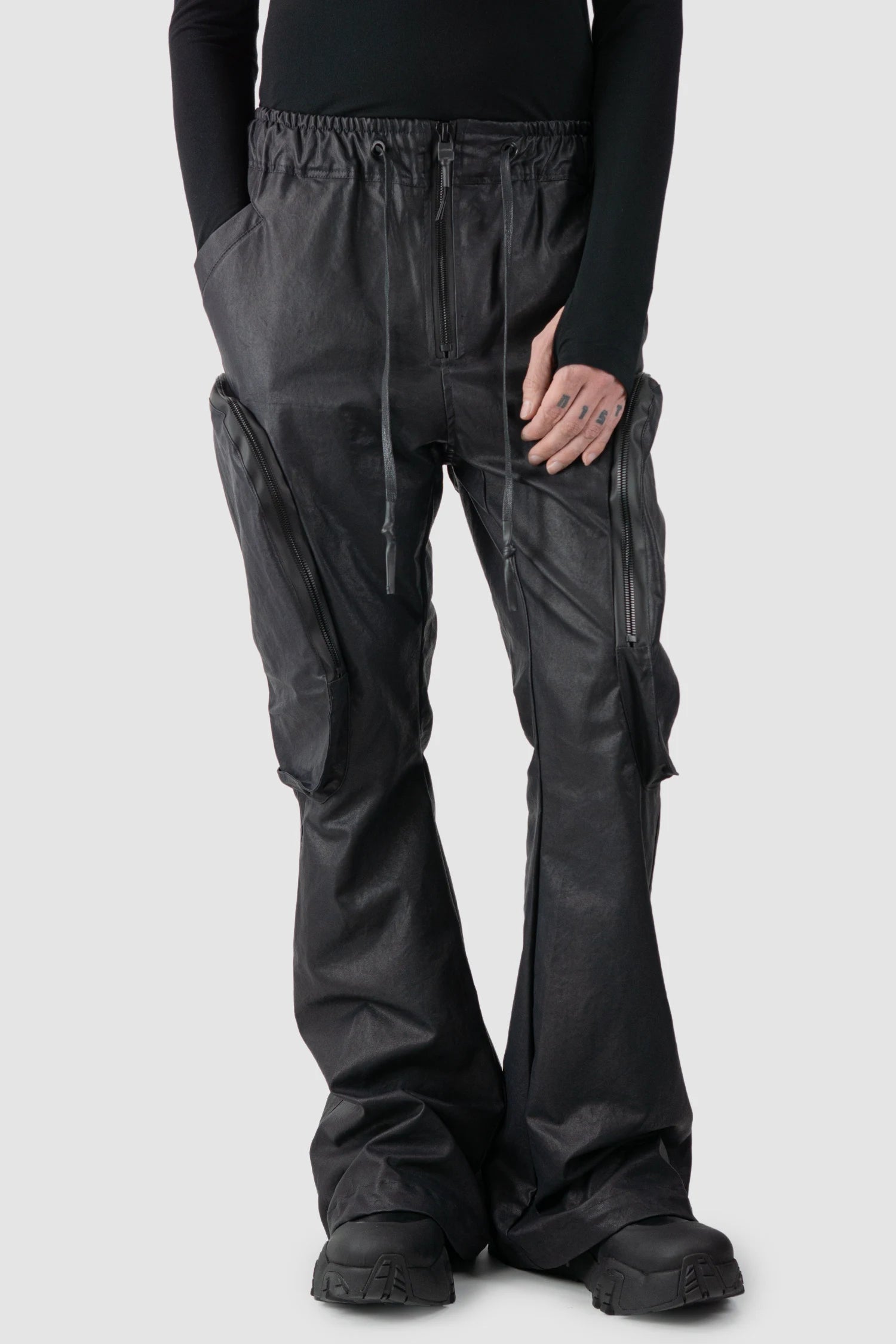 Gall Laboratories by Justin Gall - model front relaxed view of men’s Black Heavy Coated Wide Leg Cargo Trousers
