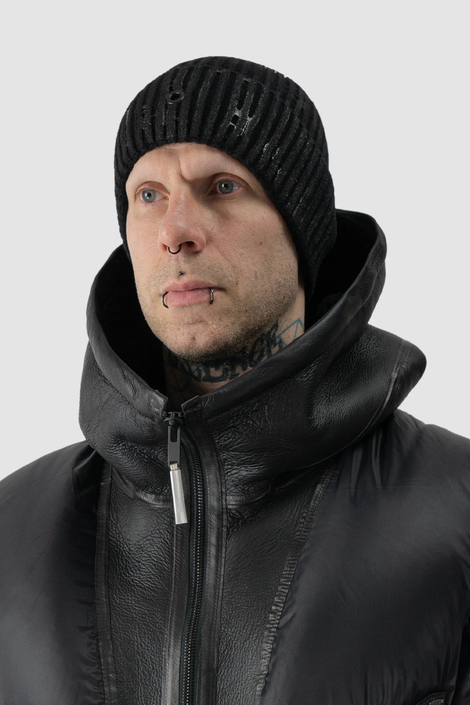 Gall Laboratories by Justin Gall - model side view of men’s Black Tar-Coated Cotton Nylon Knit Beanie