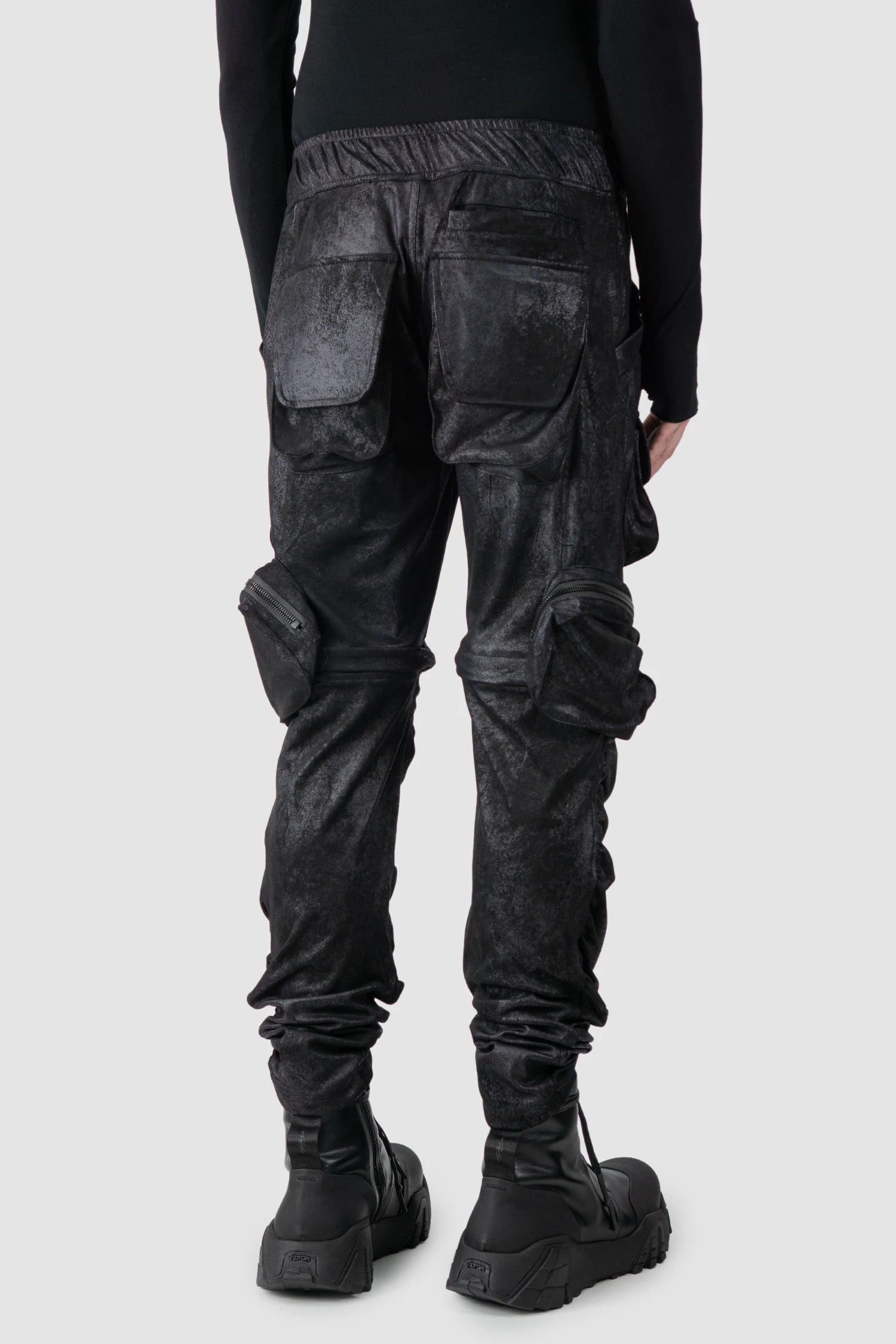 Gall Laboratories by Justin Gall - model back side view of men’s Black Vegan Leather Convertible Cargo Trousers