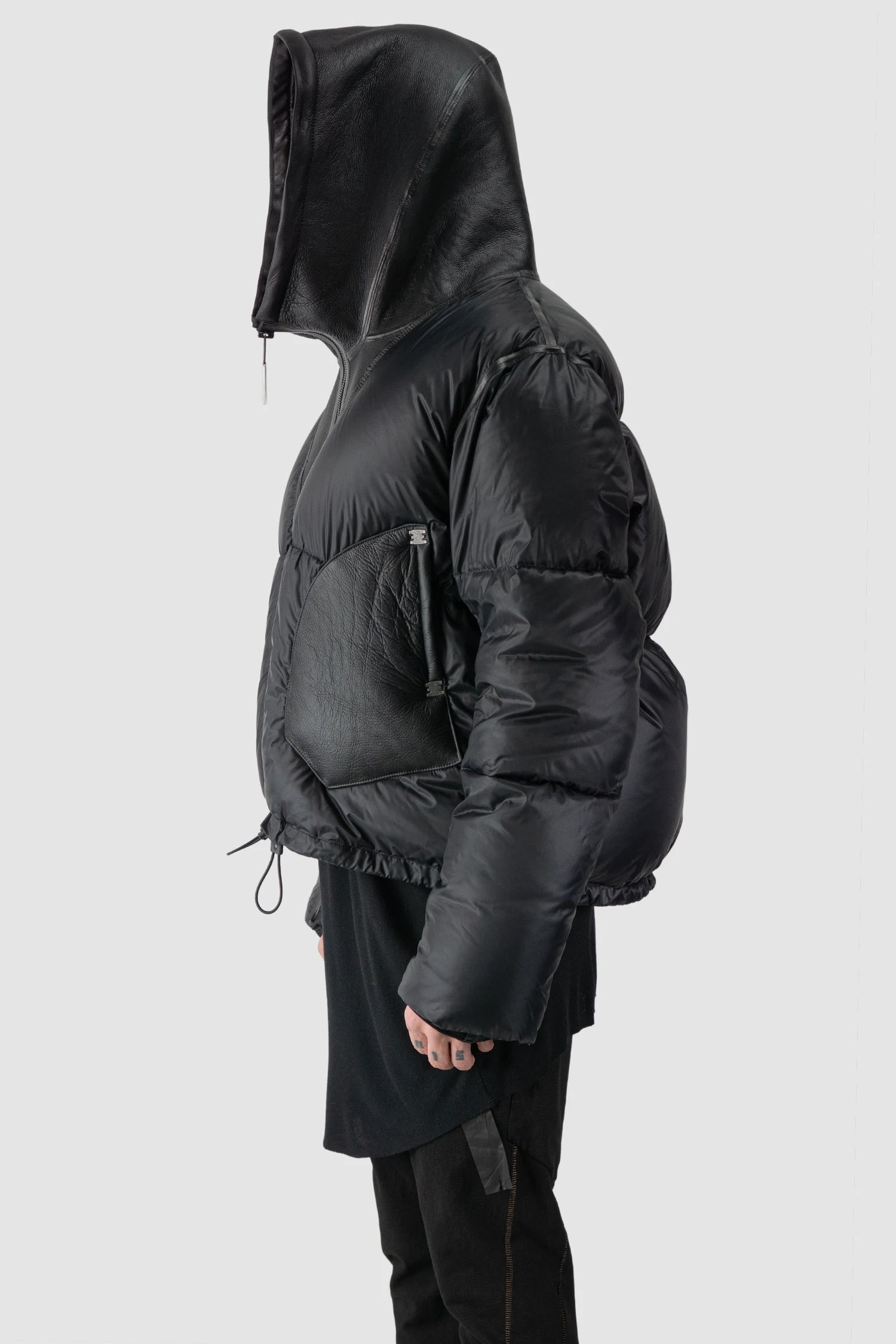 Isaac Sellam - hooded side detail view of men’s Black Hooded Cropped Shearling and Down Puffer Jacket