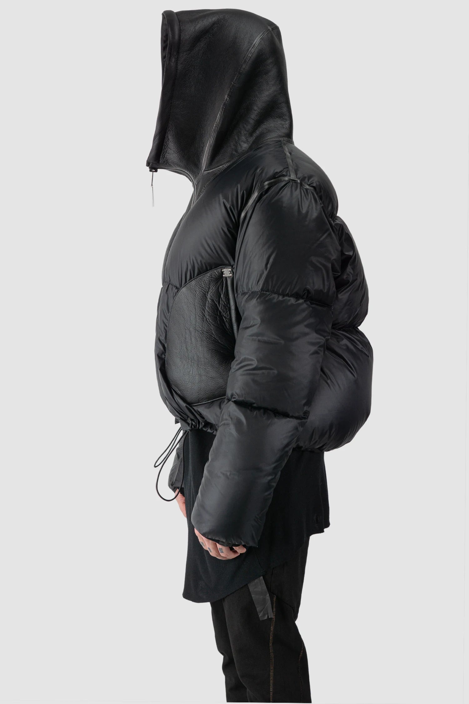 Isaac Sellam - hooded side tight view of men’s Black Hooded Cropped Shearling and Down Puffer Jacket