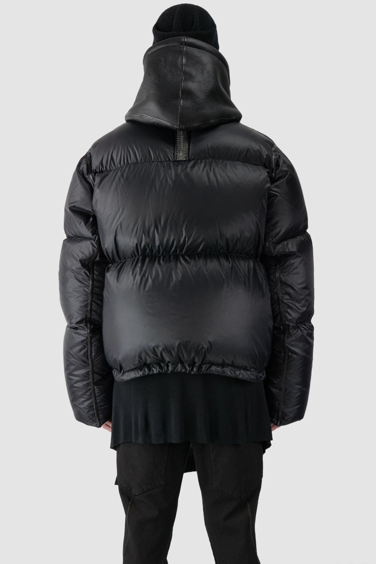 Isaac Sellam - model back view of men’s Black Hooded Cropped Shearling and Down Puffer Jacket