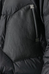 Isaac Sellam - pocket detail view of men’s Black Hooded Cropped Shearling and Down Puffer Jacket