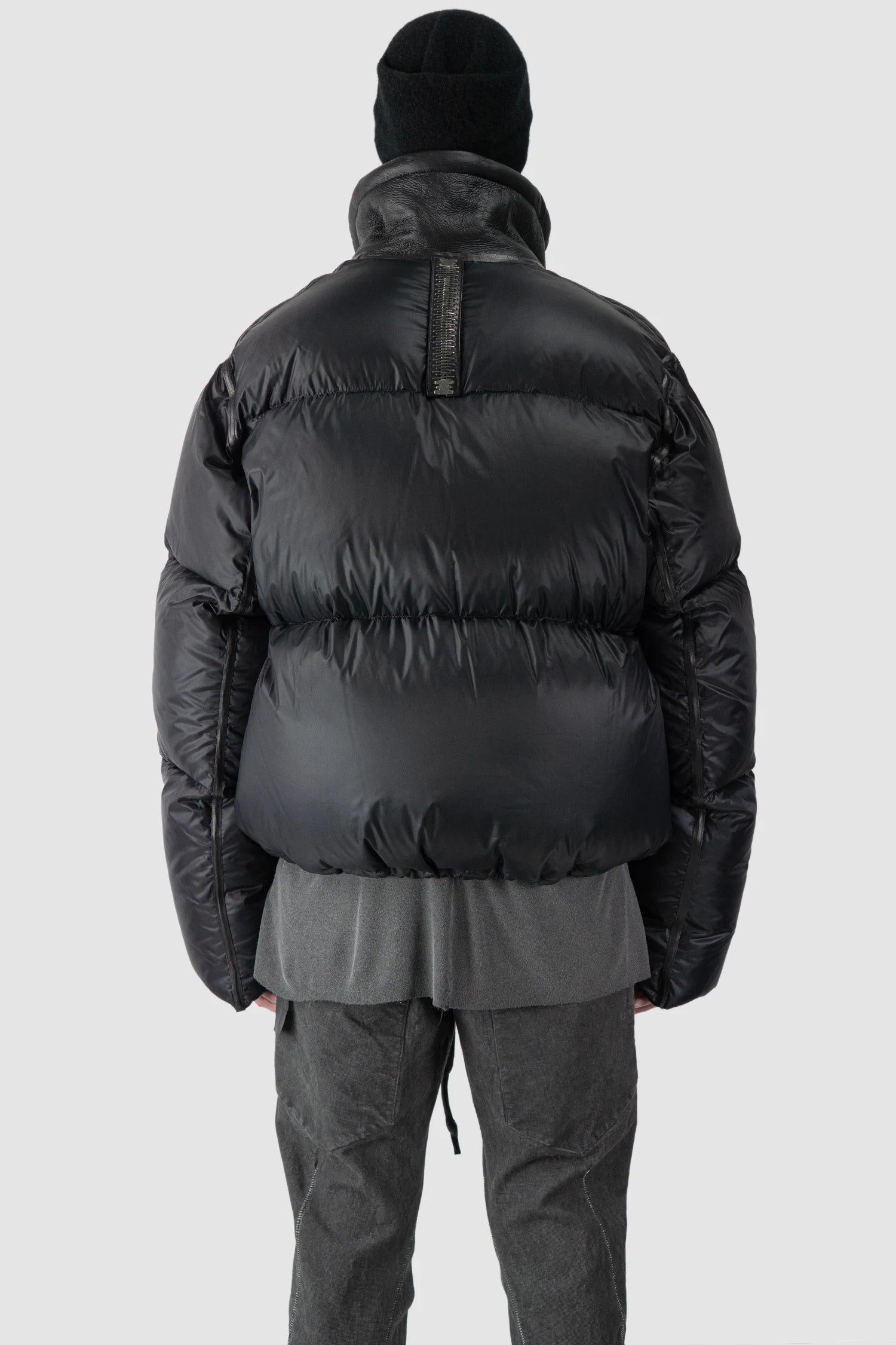 Isaac Sellam - model back tight hem view of men’s Black Shearling Leather and Down Cropped Puffer Jacket