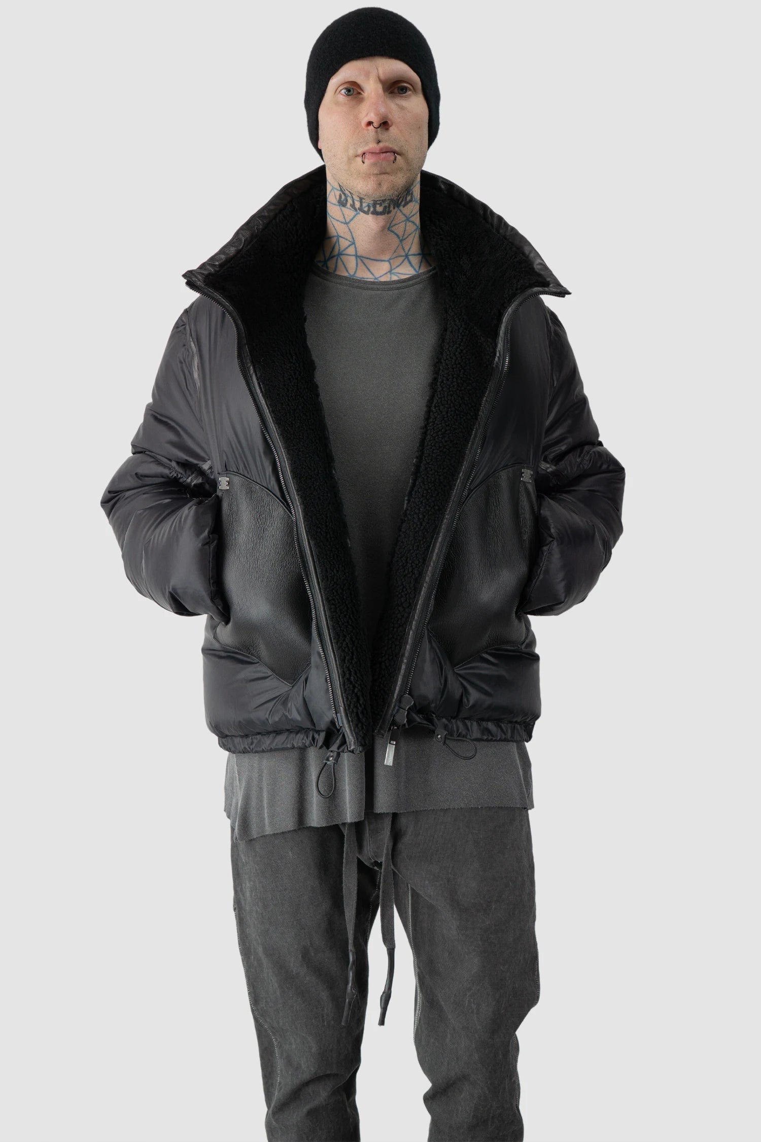 Isaac Sellam - model front relaxed view of men’s Black Shearling Leather and Down Cropped Puffer Jacket