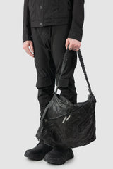 Isaac Sellam Experience - Balladeur Men’s Black Large Asymmetric Lamb Leather Shoulder Bag model hand hold view