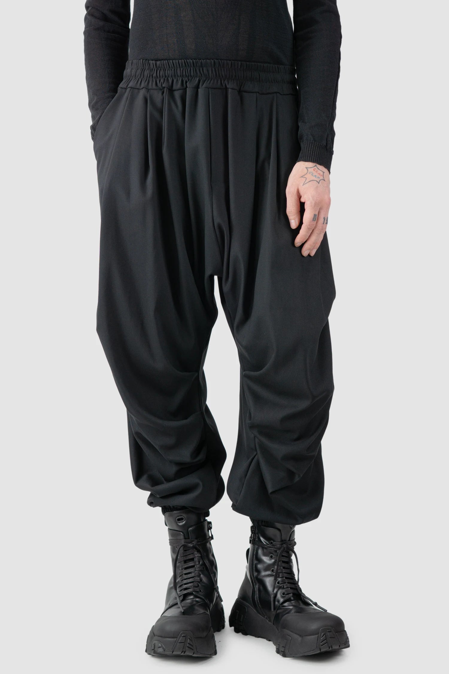 La Haine Inside Us - model front relaxed view of men’s Black Fluid Leg Draping Trousers