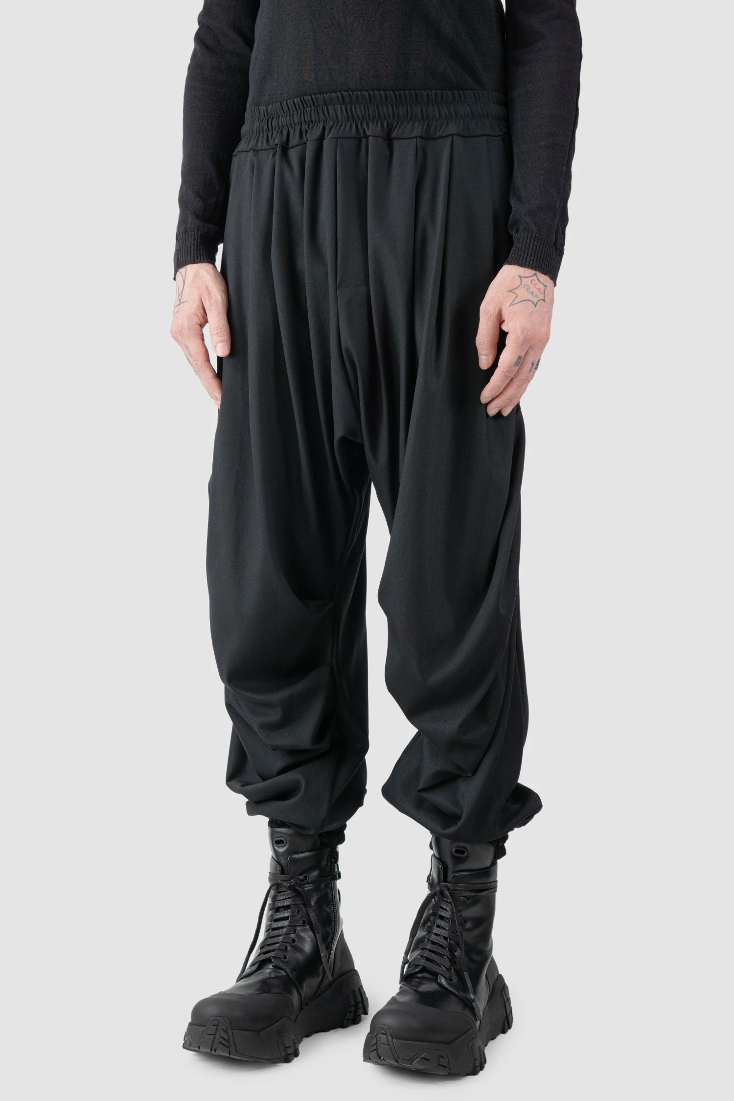 La Haine Inside Us - model front side view of men’s Black Fluid Leg Draping Trousers