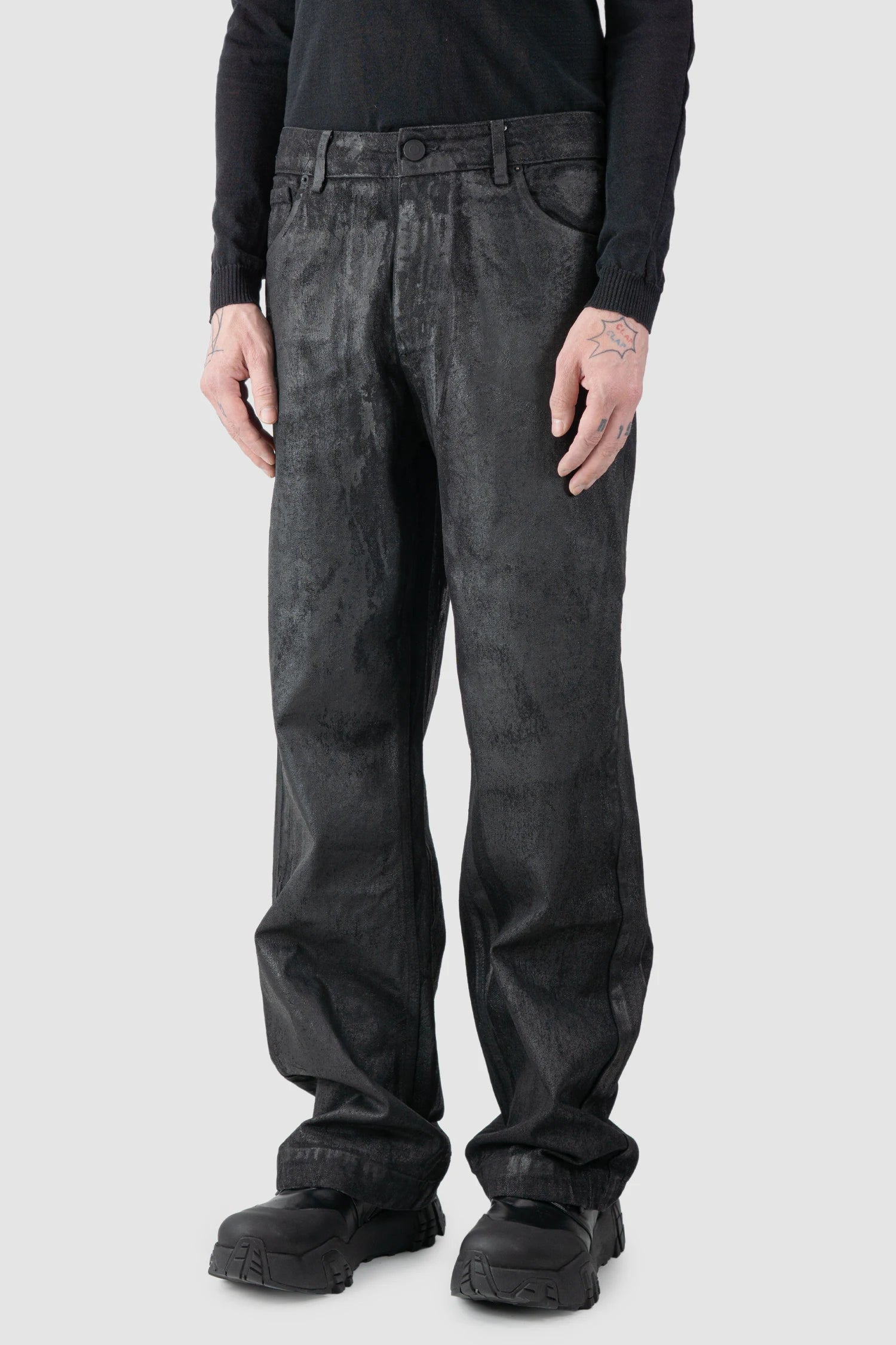 La Haine Inside Us - model front side view of men’s Black Hand-Painted Rubberized Coated Denim Jeans