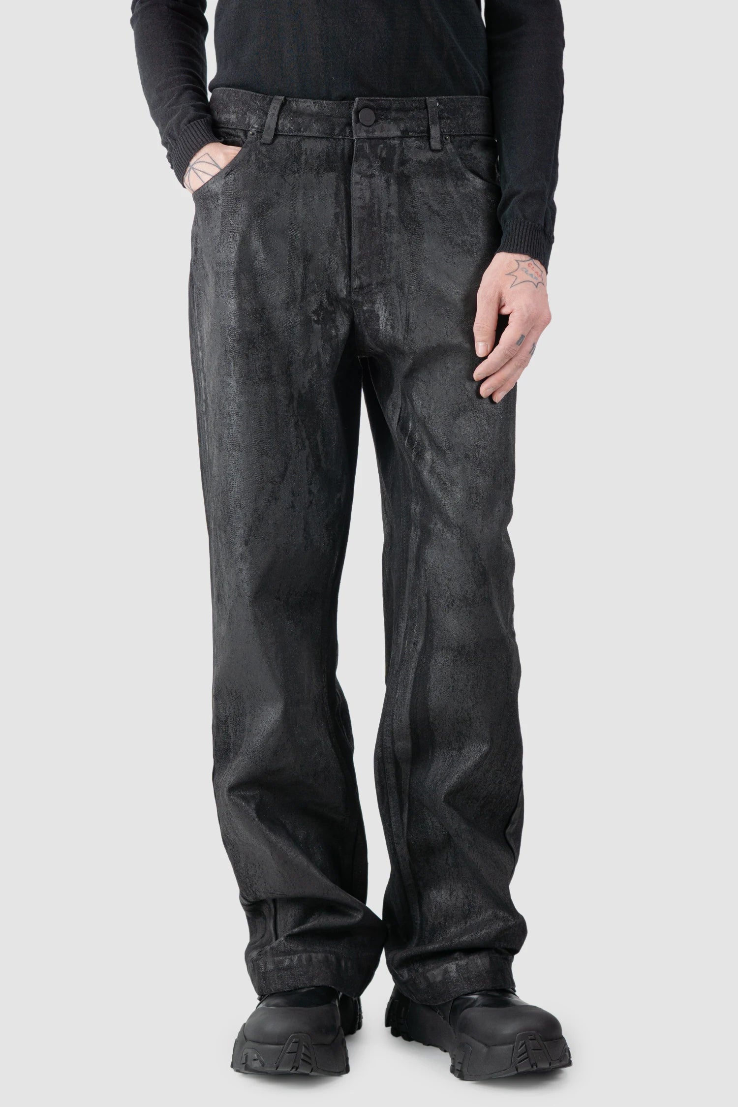 La Haine Inside Us - model front relaxed view of men’s Black Hand-Painted Rubberized Coated Denim Jeans