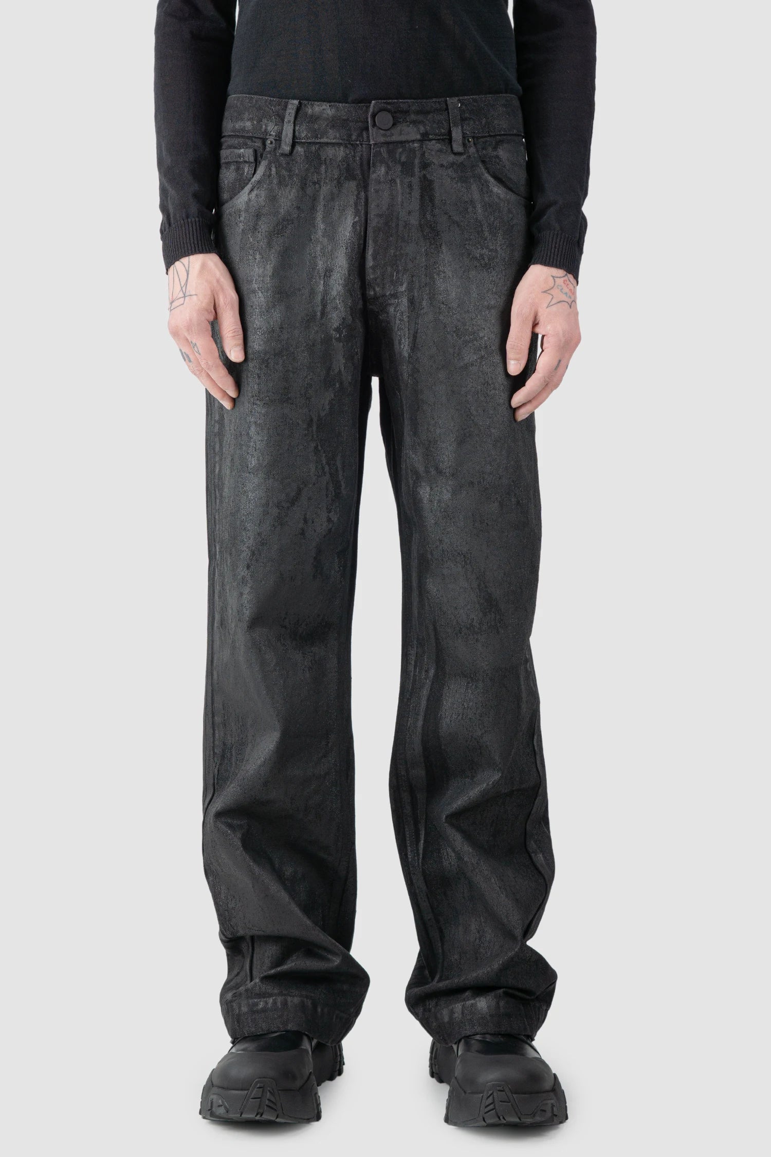 La Haine Inside Us - model front view of men’s Black Hand-Painted Rubberized Coated Denim Jeans