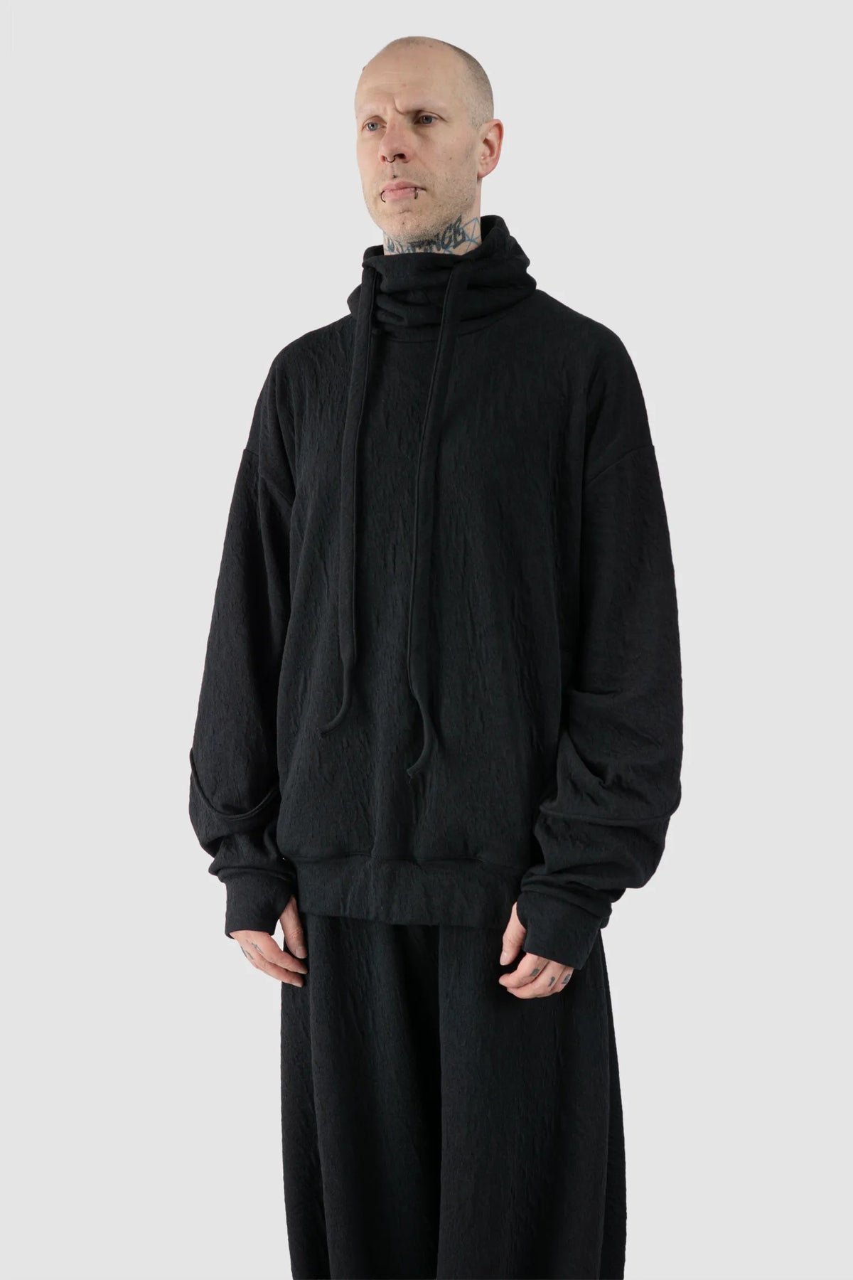 La Haine Inside Us - Men's Black High Neck Embossed Sweater - model front side view - MONO-KROM | Gallery
