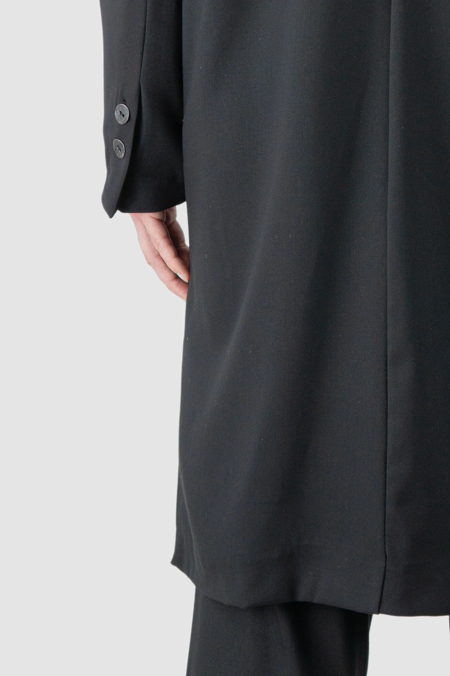 La Haine Inside Us - model back hem view of men’s Black Long Fluid Blazer Jacket