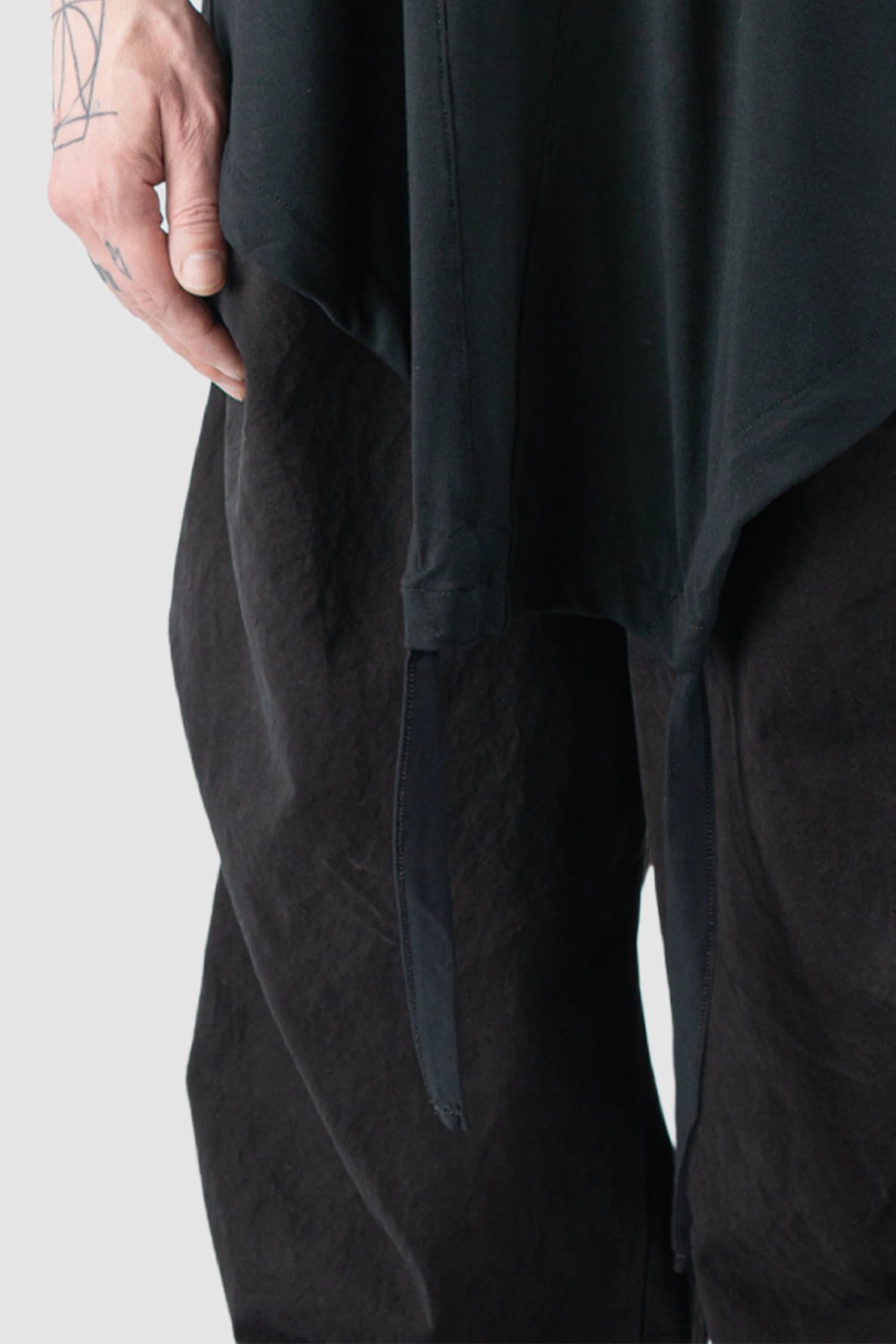 La Haine Inside Us - Men’s Black Relaxed Bamboo Longline T-Shirt model hem detail view