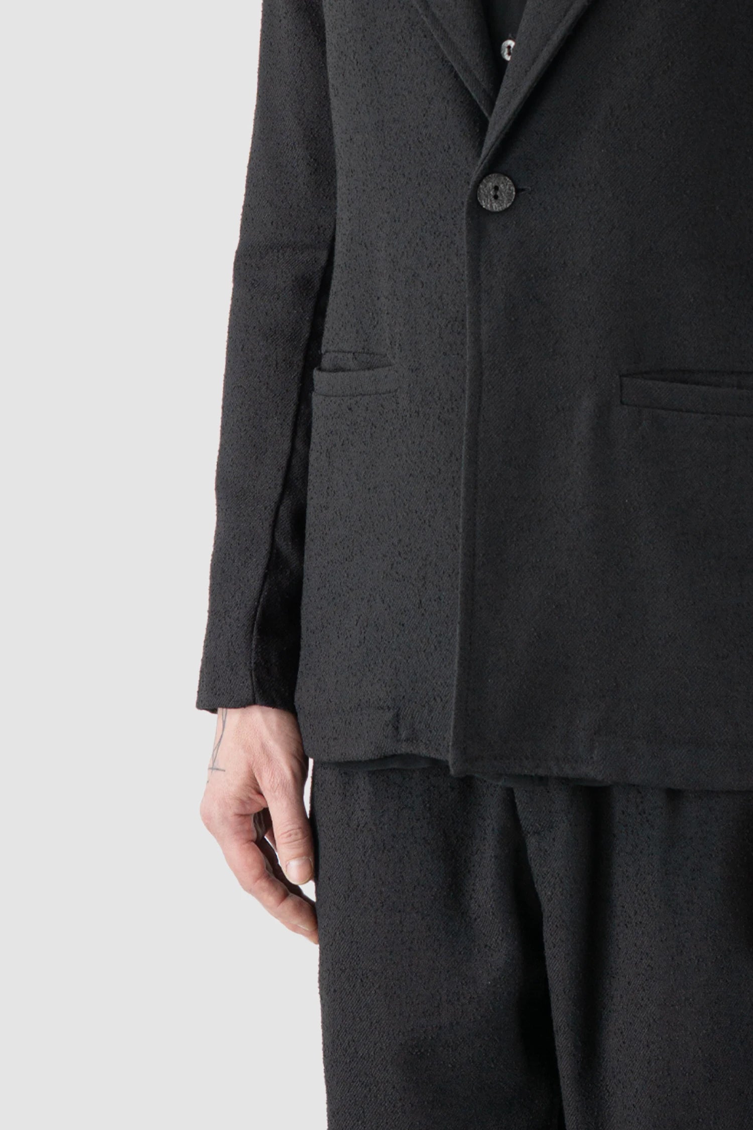 La Haine Inside Us - hem detail view of men’s Black Single Button Soft Blazer