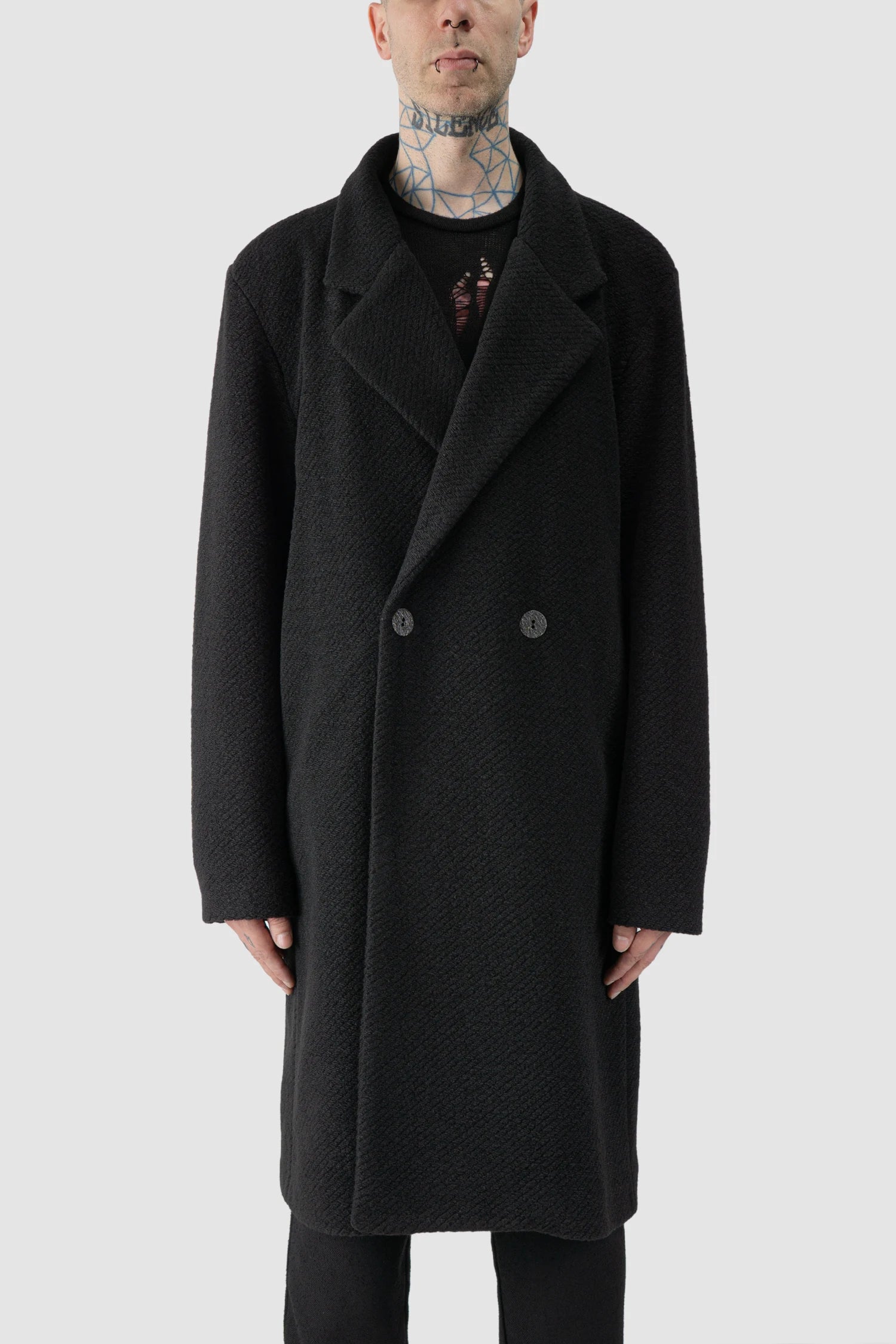 La Haine Inside Us - model front view of men’s FW25 Black Long Wool Blend Coat with 2-Button Closure