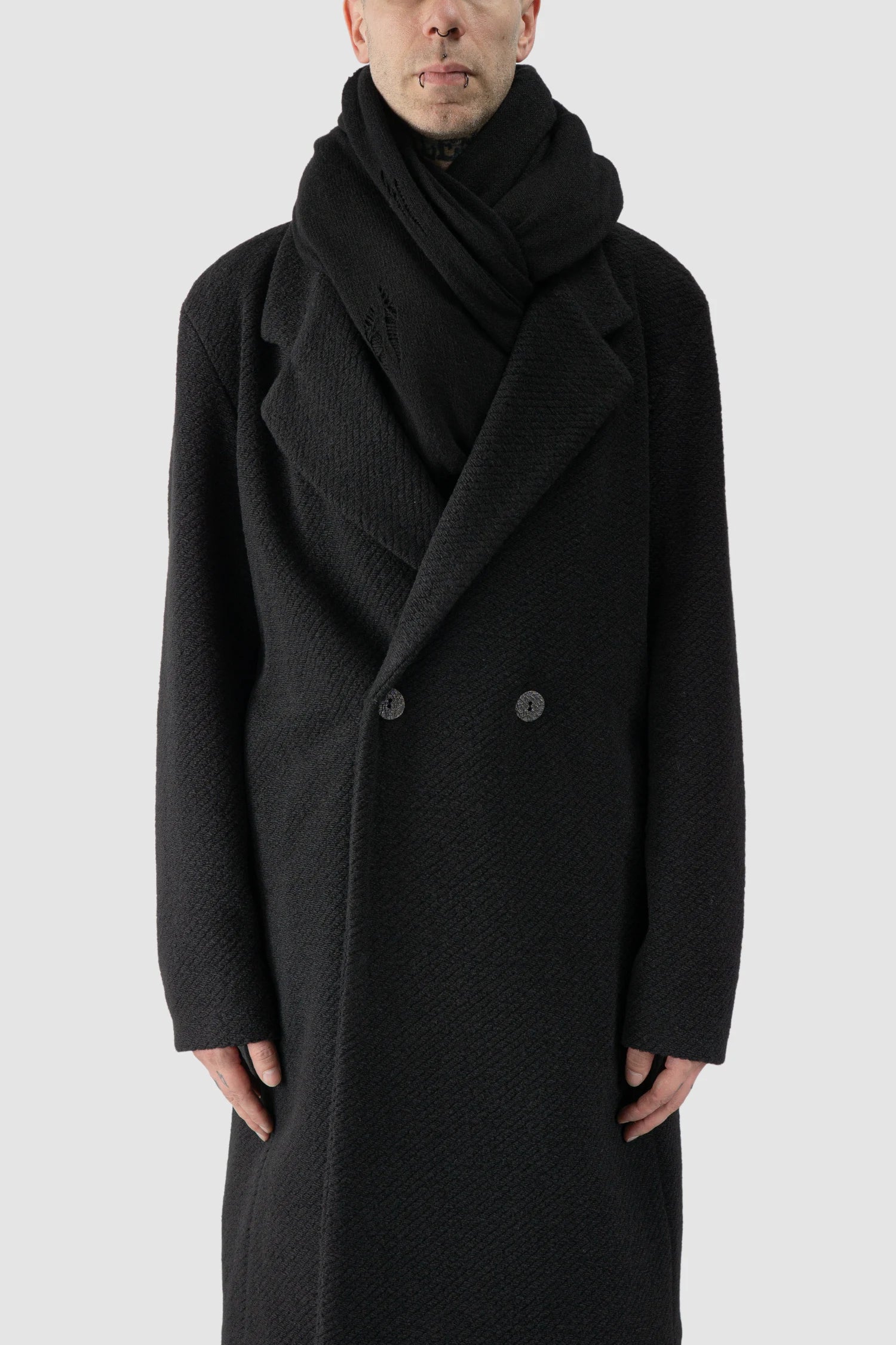 La Haine Inside Us - model front view of men’s FW25 Black Oversized Loop Viscose Blend Knit Scarf
