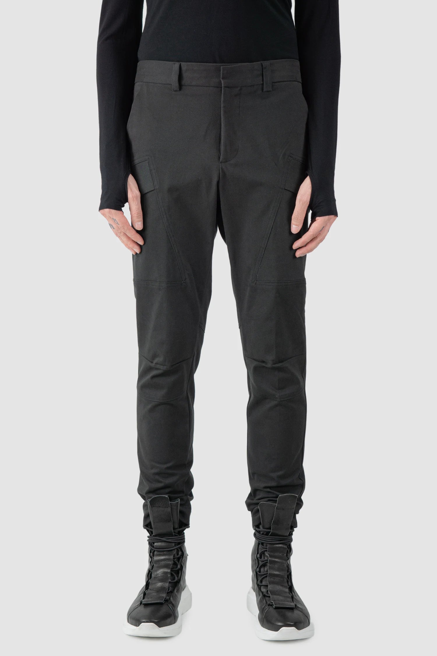 La Haine Inside Us - model front view of men’s FW25 Black Slim Fit Stretch Cotton Cargo Trousers