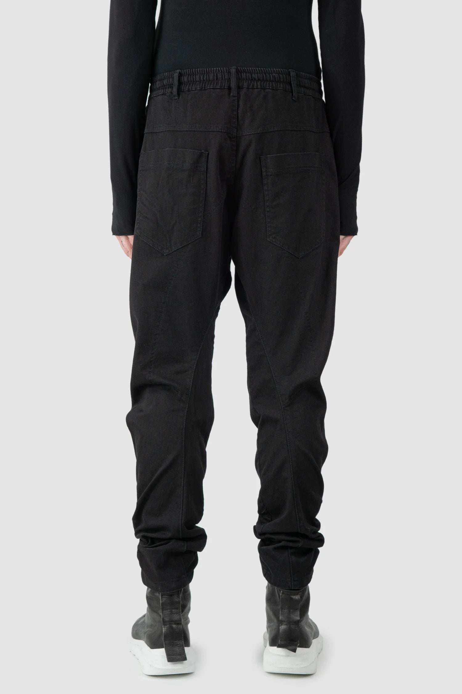 La Haine Inside Us - model back view of men’s FW25 Black Twisted Leg Stretch Denim Jeans