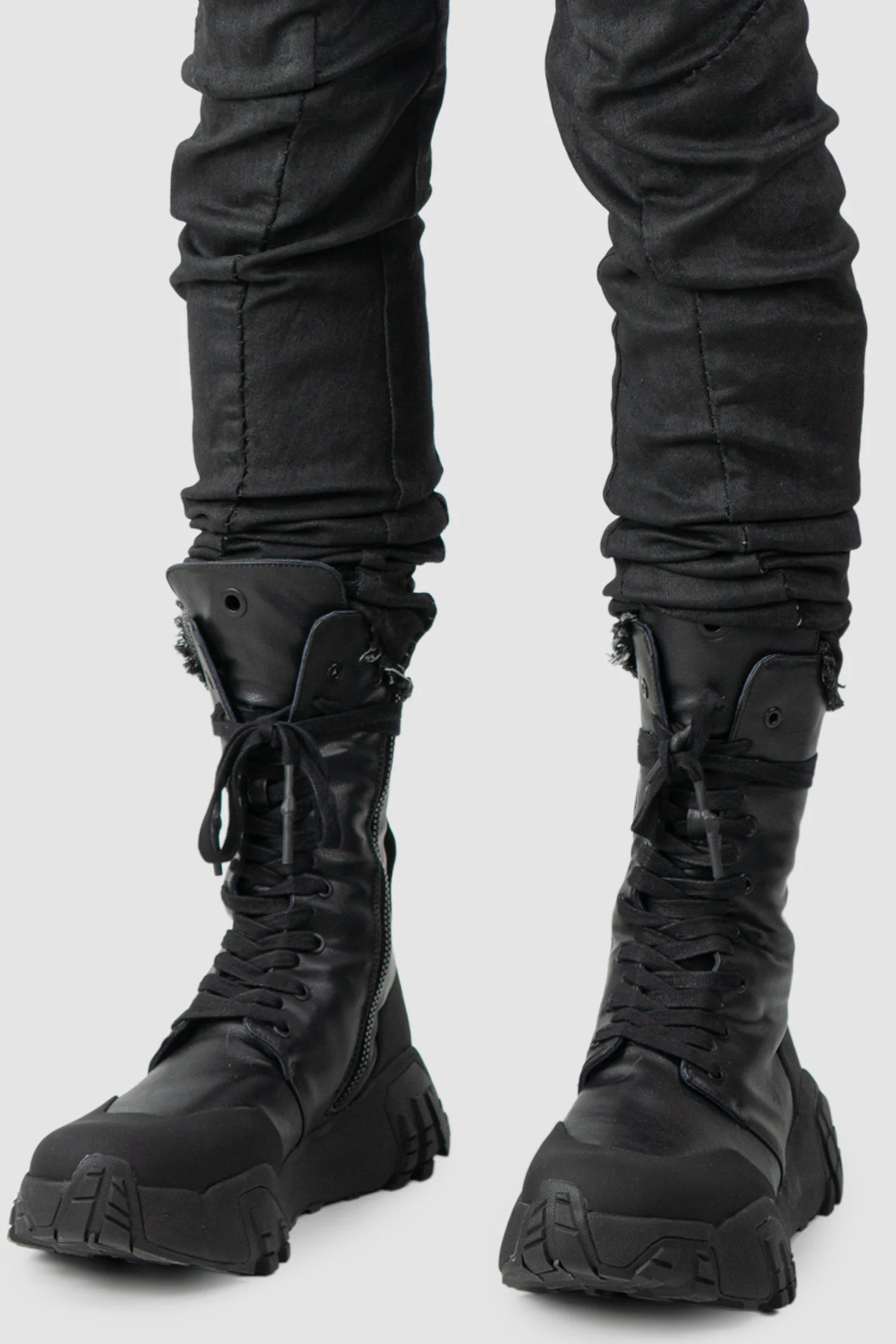 Masnada – Men's Black Waxed Curved Seam Denim Jeans - front hem detail view