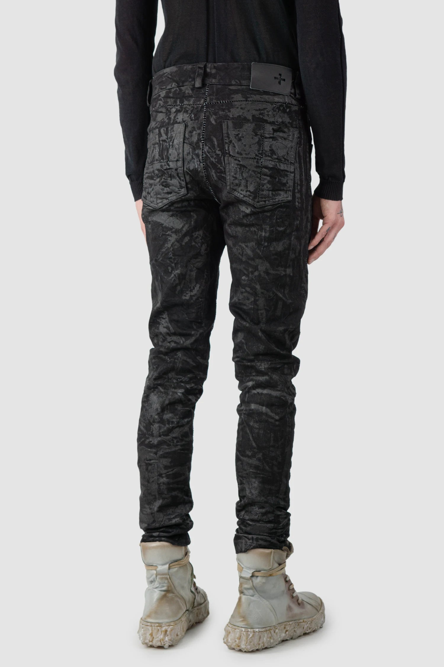 MD75 - model back side view of men’s Black Sandpaper Coated Stacked Denim Jeans