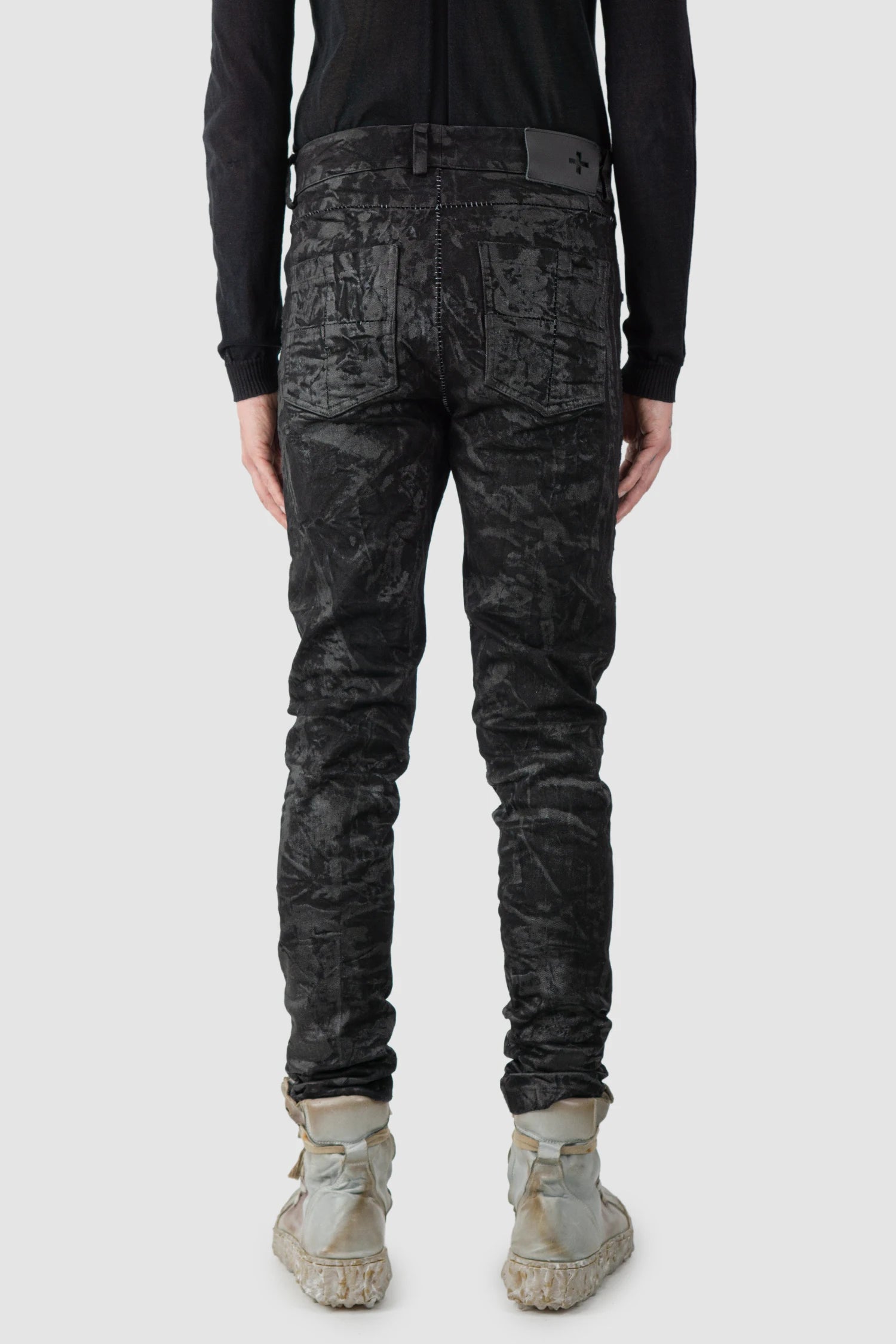 MD75 - model back view of men’s Black Sandpaper Coated Stacked Denim Jeans