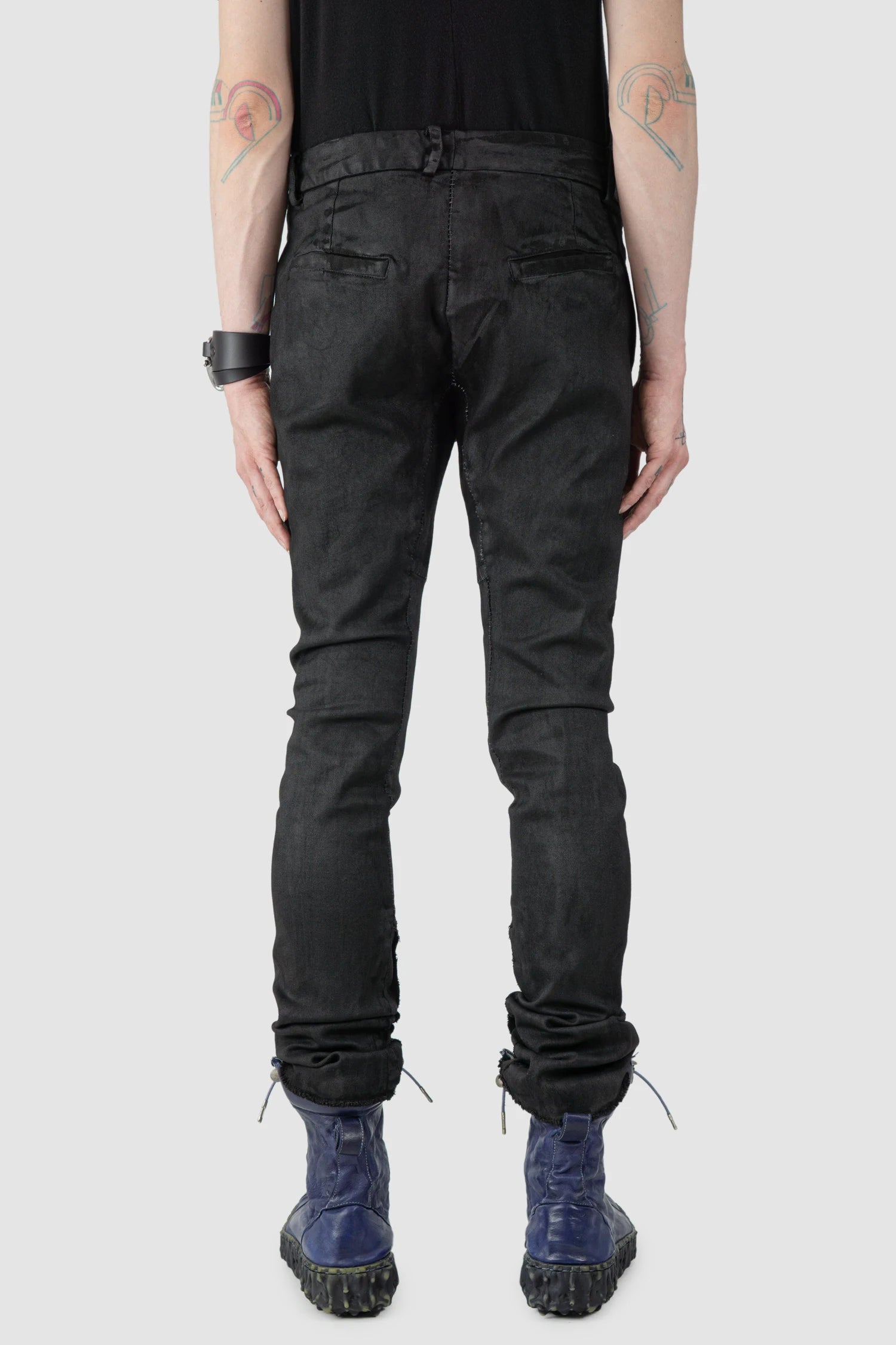 MD75 - model back view of men’s Black Irregular Heavy Waxed Denim Jeans