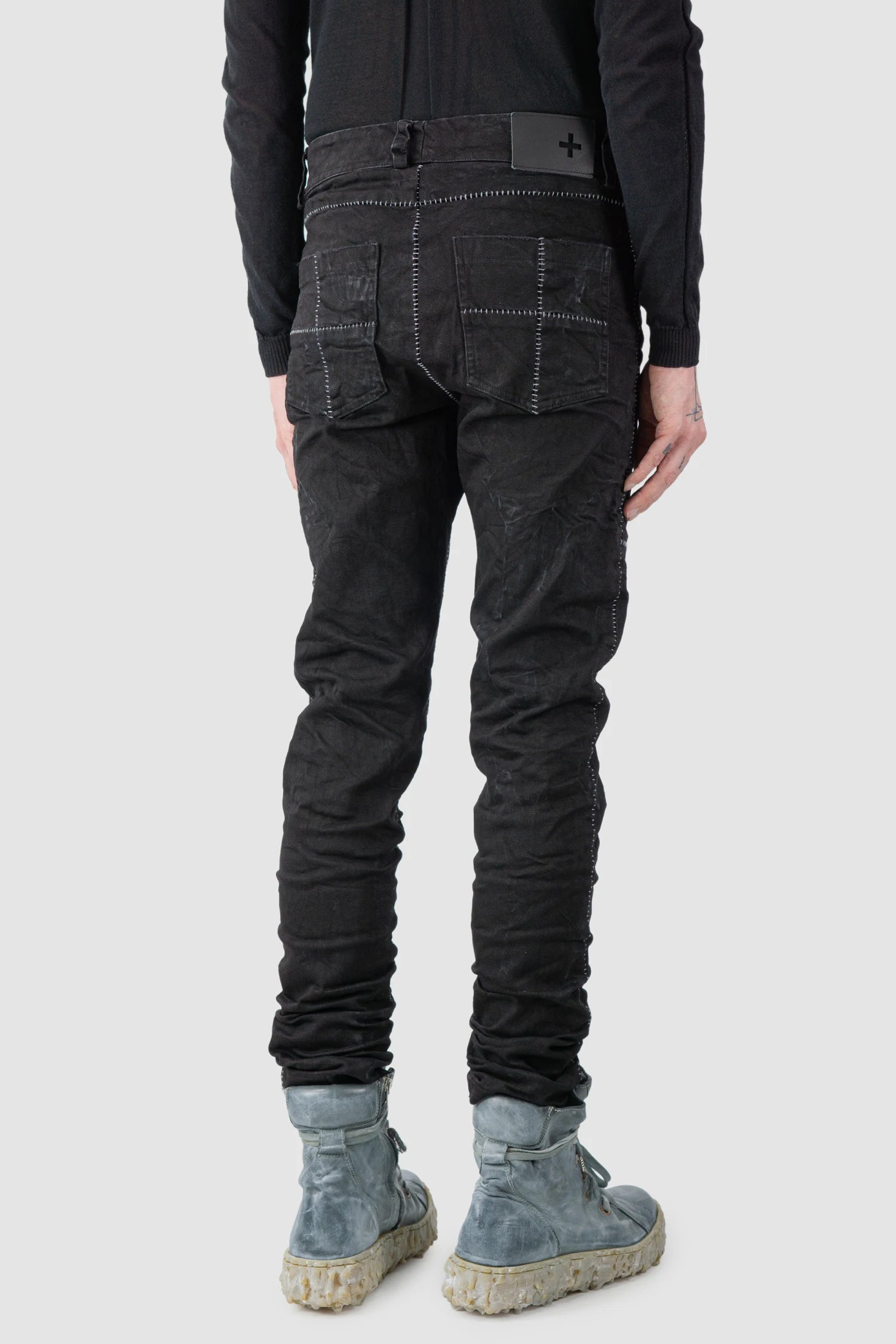 MD75 - model back side view of men’s Black Stone Washed Stacked Denim Jeans