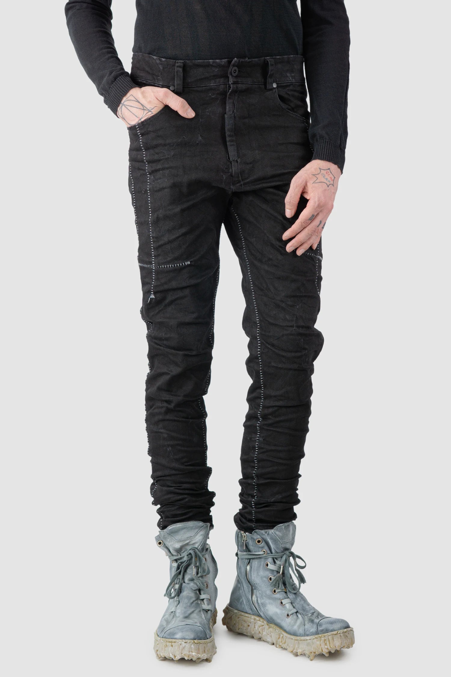 MD75 - model relaxed front view of men’s Black Stone Washed Stacked Denim Jeans