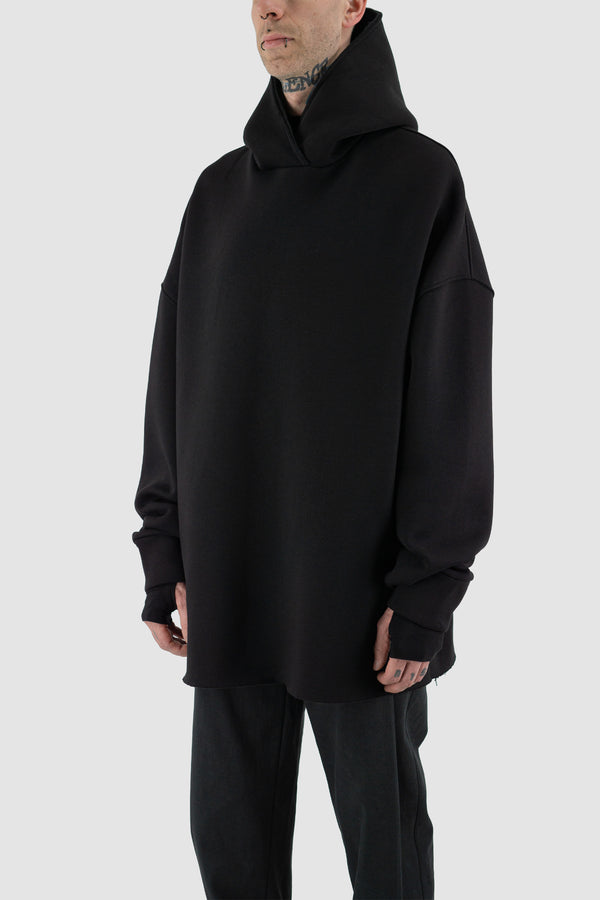 Black Mega Hoodie by UY STUDIO in the FW23 'BACK TO SCHOOL' Collection. Extra oversize fit, raglan shoulders, double-layered oversized hood with raw details, and visible vegan Leather UY Label. Composition: 70% Cotton, 30% PL.