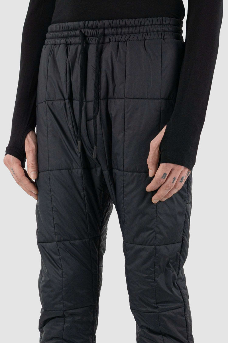 Close up view of Black Quilted Slim Pants for Men with recycled polyamide and merino wool, FW23, NOMEN NESCIO