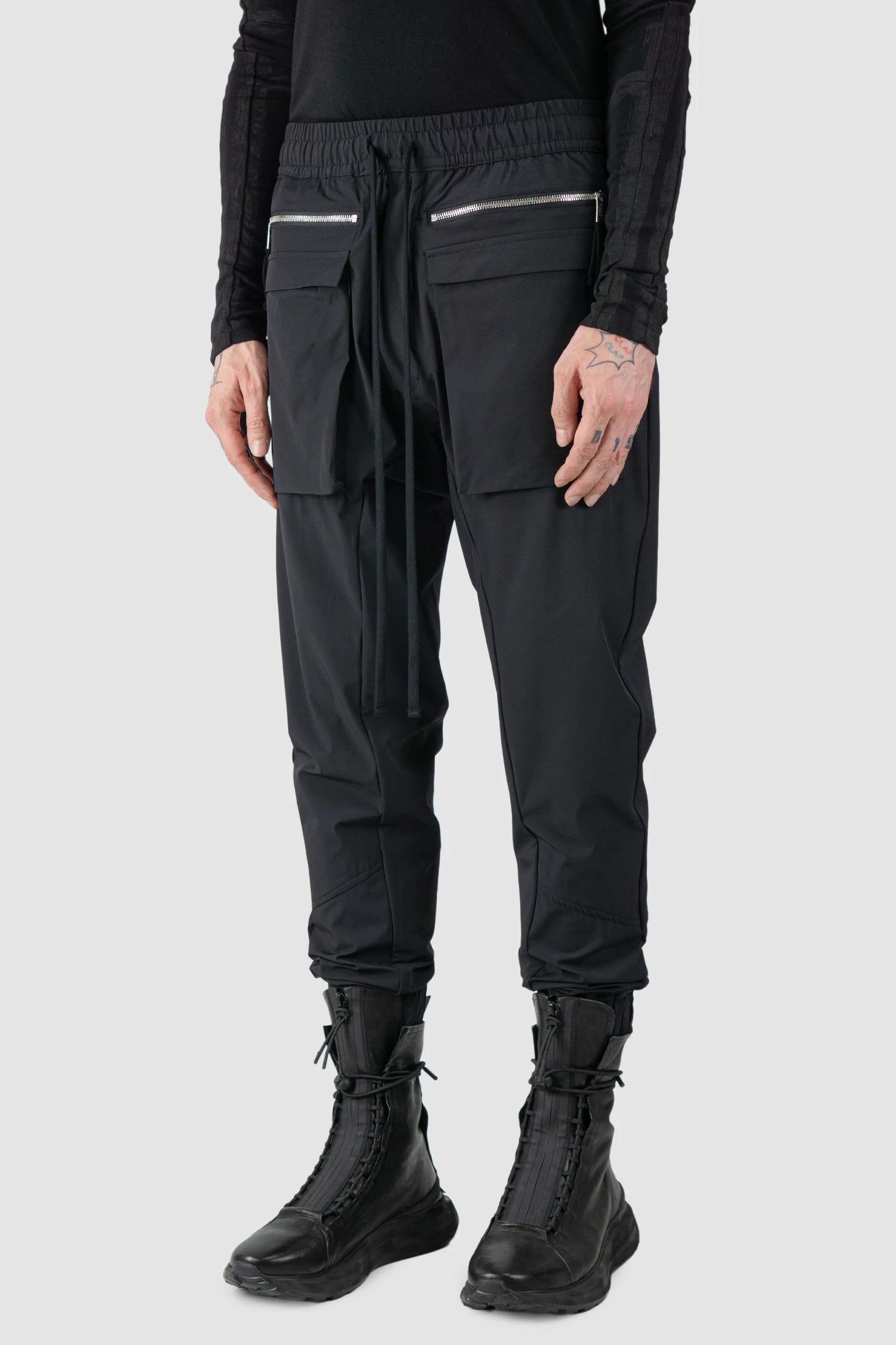 Thom Krom - model side view of men’s FW25 Black Front Pocket Woven Stretch Cargo Trousers - M-P-27