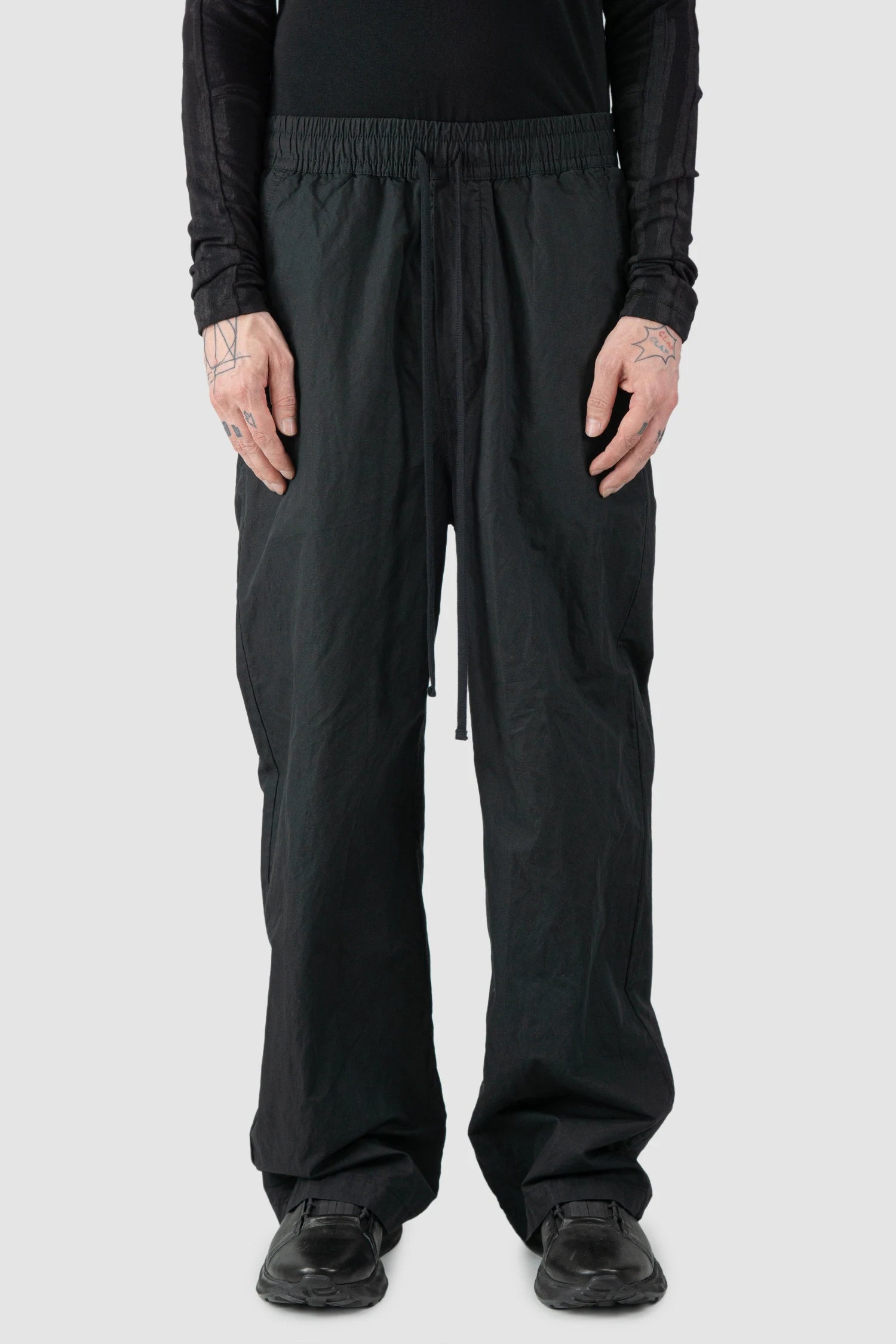 Thom Krom - model front view of men’s FW25 Black Metallic Wide Leg Cotton Trousers - M-P-19