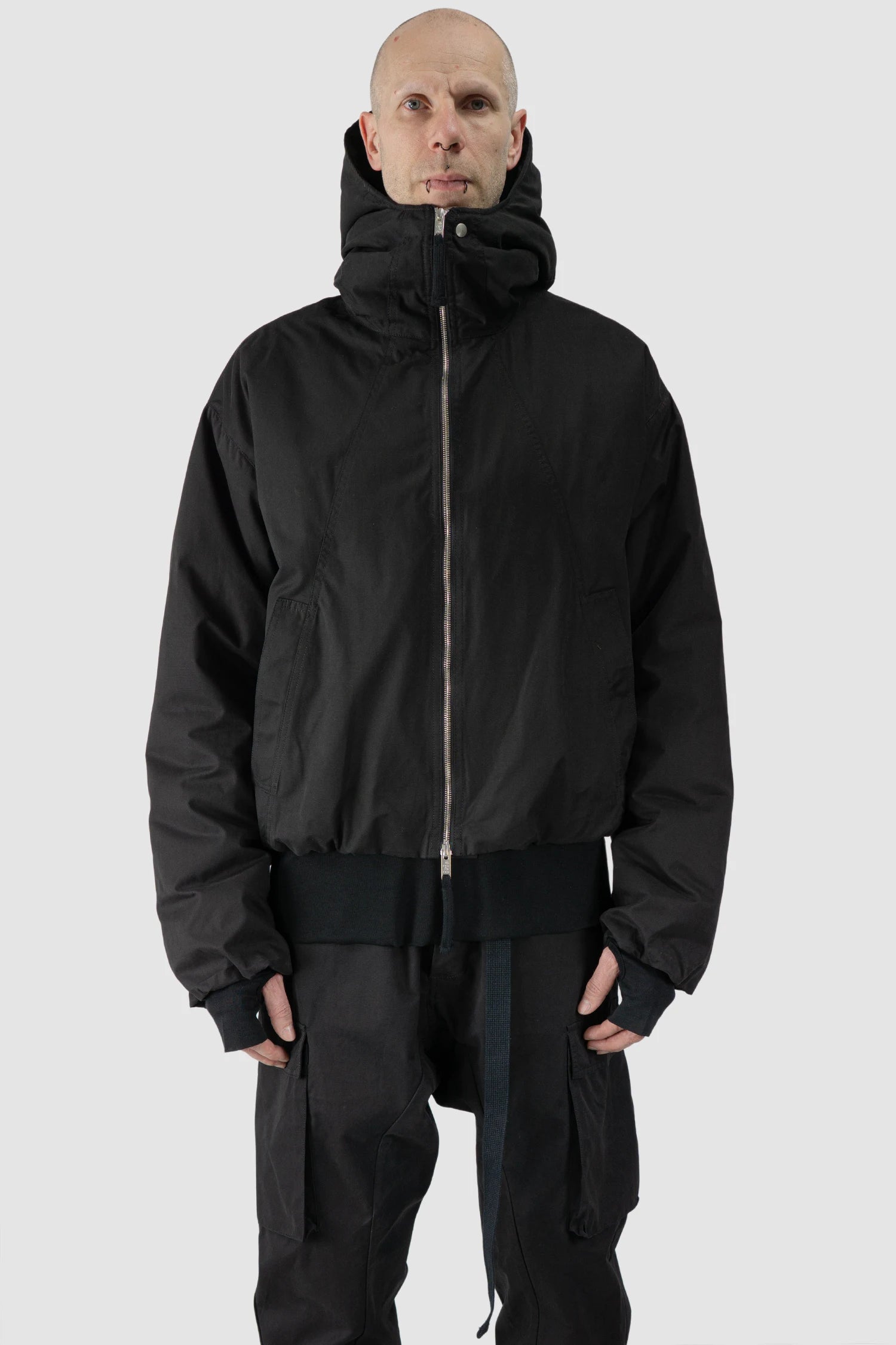 Thom Krom - model front view of men’s Black Padded Short Jacket with Magnetic Buckle Hoody M-J-74