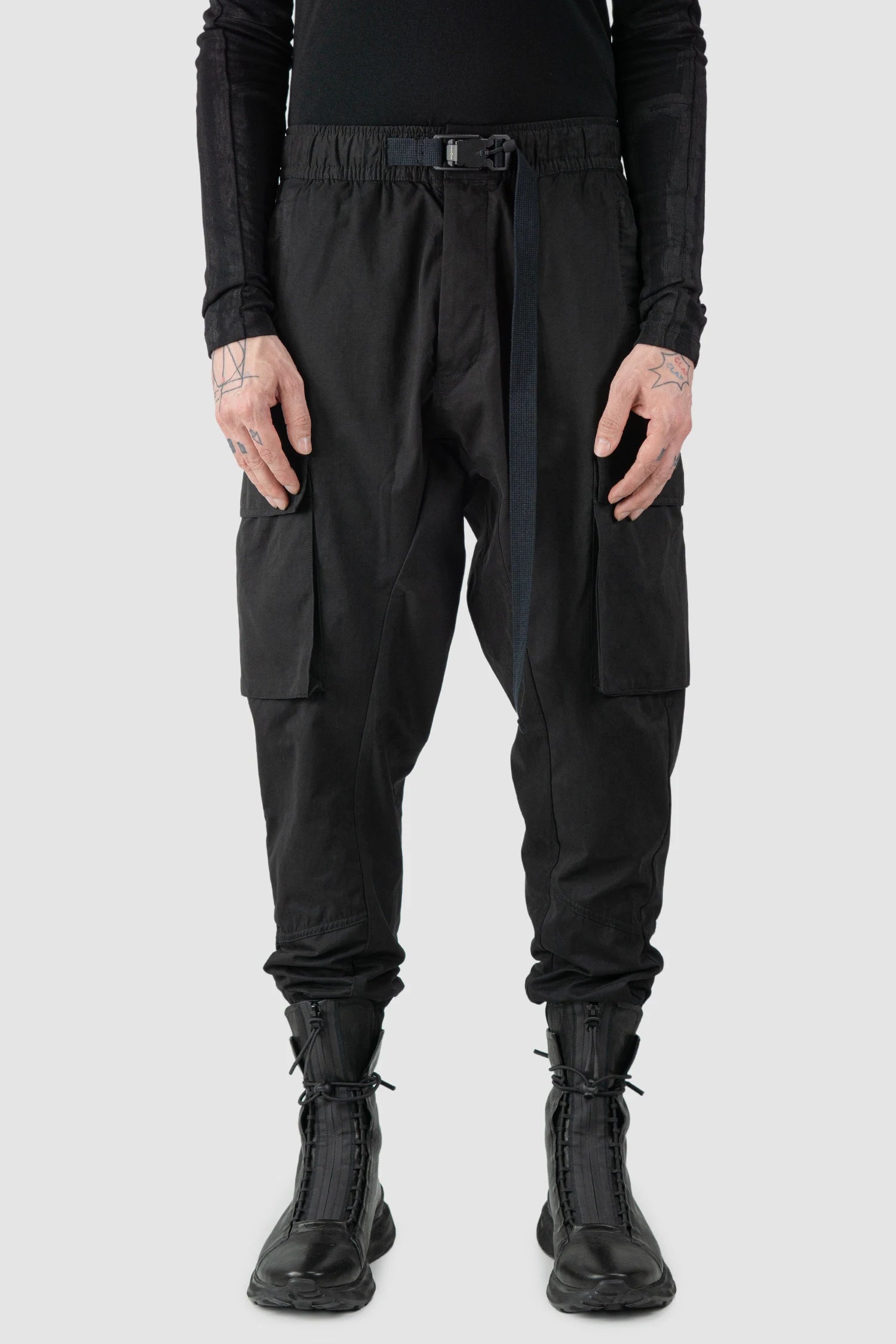 Thom Krom - model front view of men’s FW25 Black Peached Cotton Cargo Trousers with Magnetic Belt - M-P-15