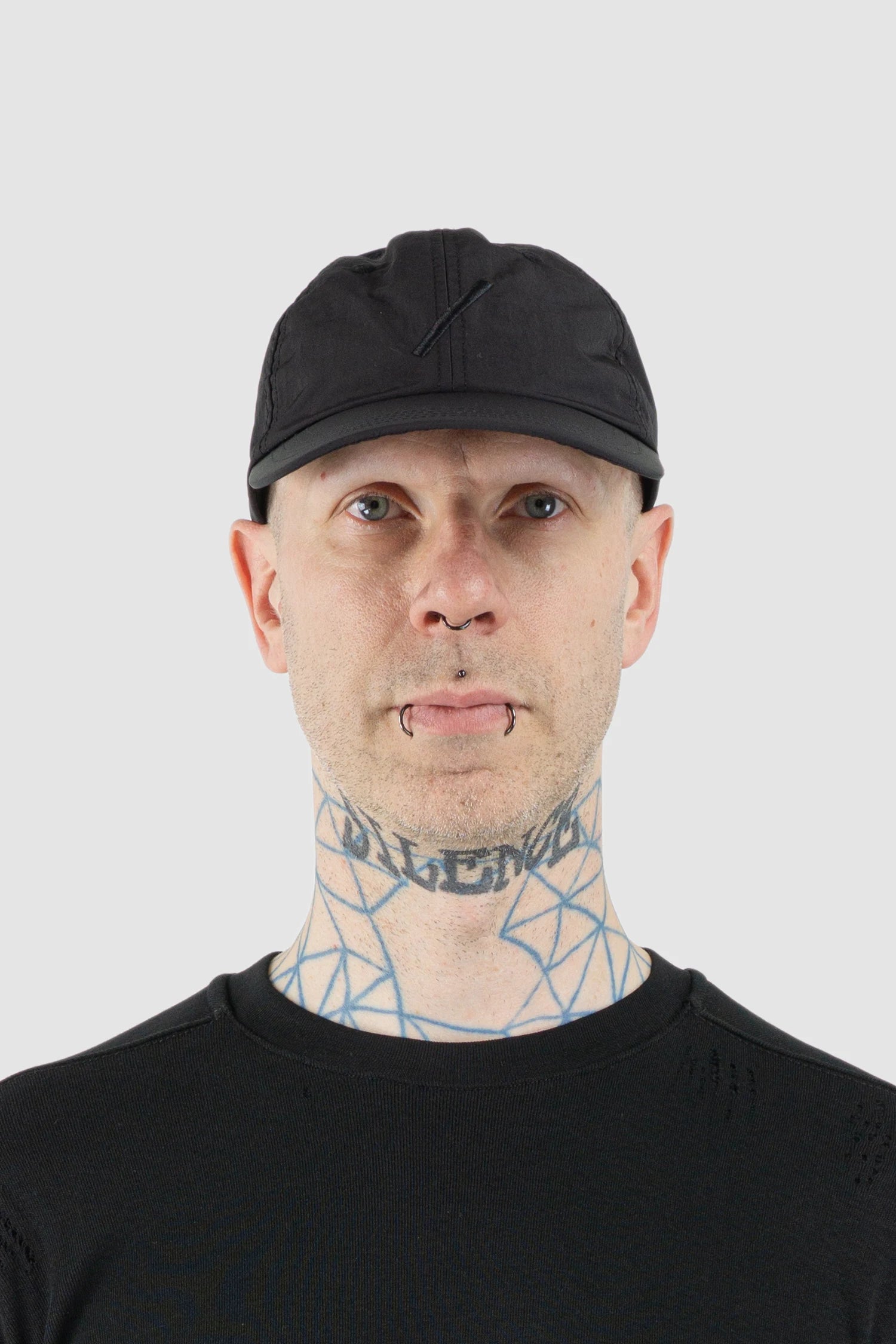 Thom Krom – Men's Black Slash Logo Base Cap - model front view - MONO-KROM | Gallery