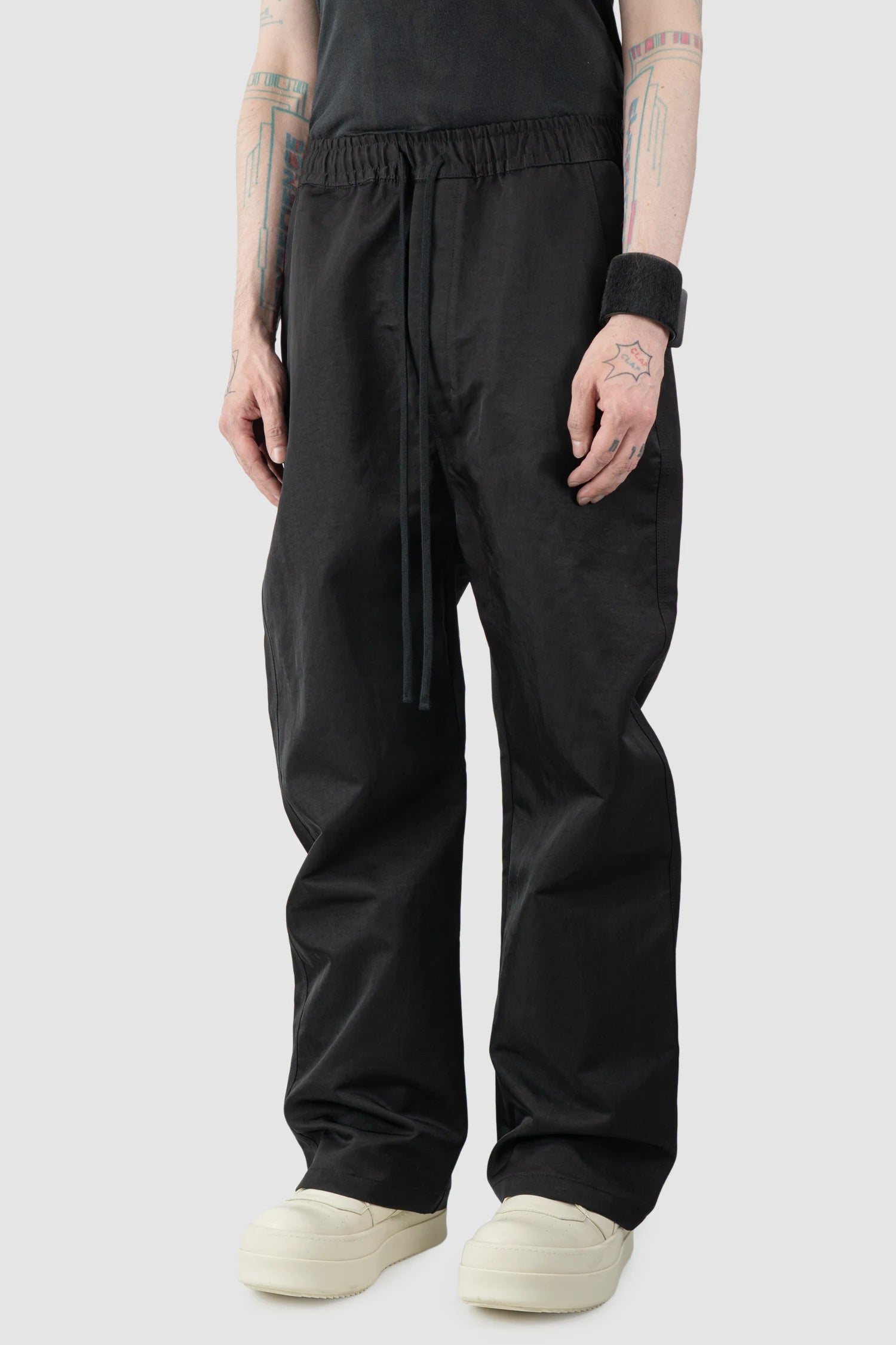Thom Krom – Men's Black Tech Woven Wide Leg Trousers - model side view - MONO-KROM | Gallery