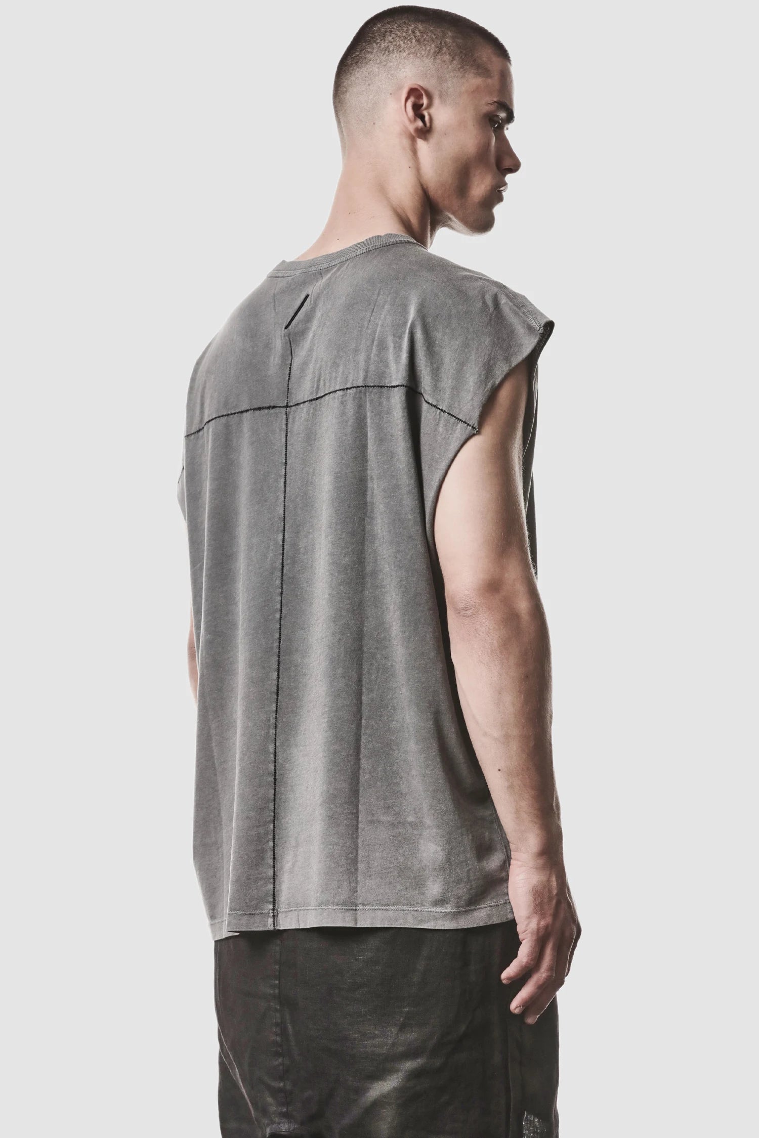 Thom Krom - model back side view of men’s Grey Oversized Round Neck Tank Top