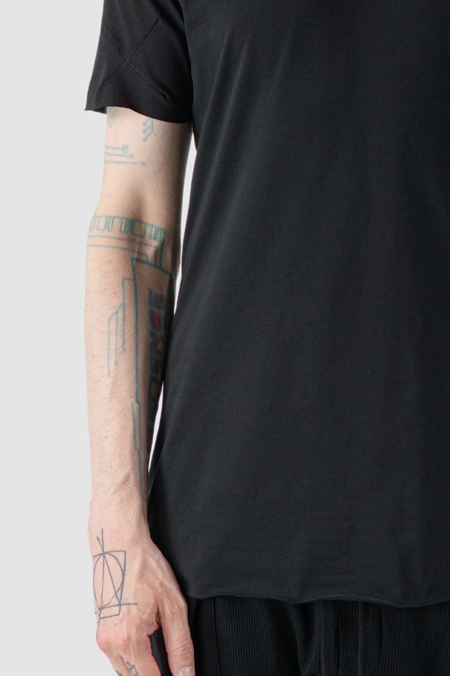Thom Krom - model front detail view of black Slim Fit Raw Hem Cotton T-Shirt - M-TS-872