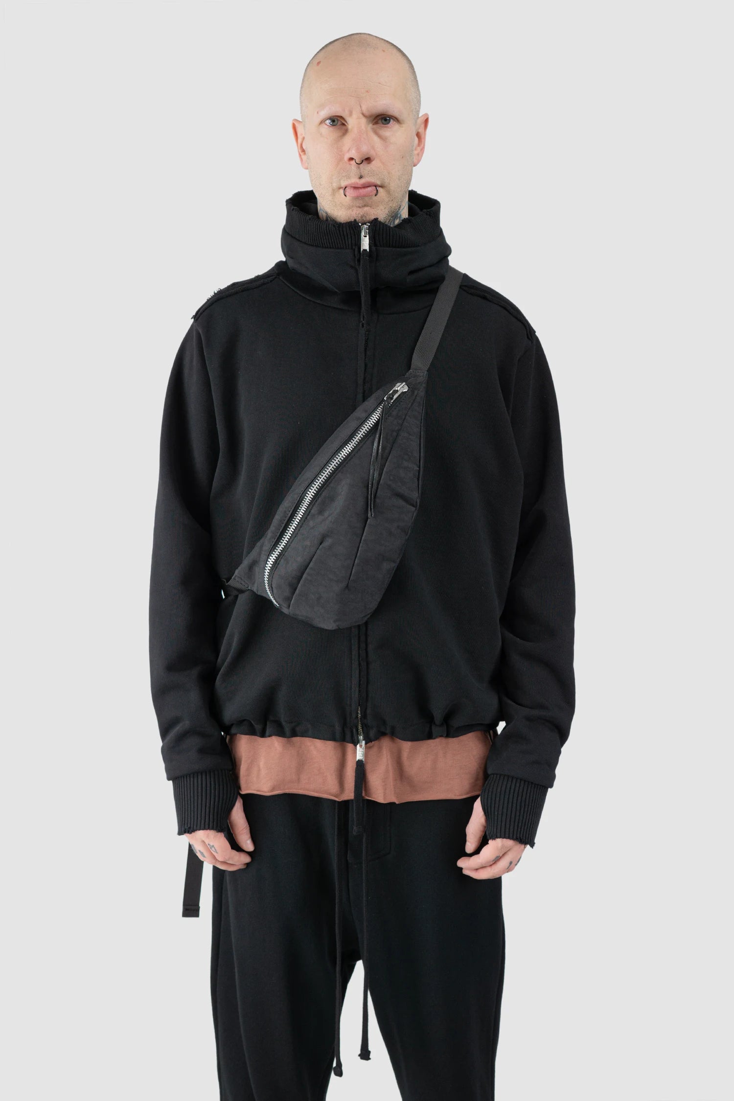 Werkschwarz - model front view of men’s Black Cross Body Waist Bag Nylon 1