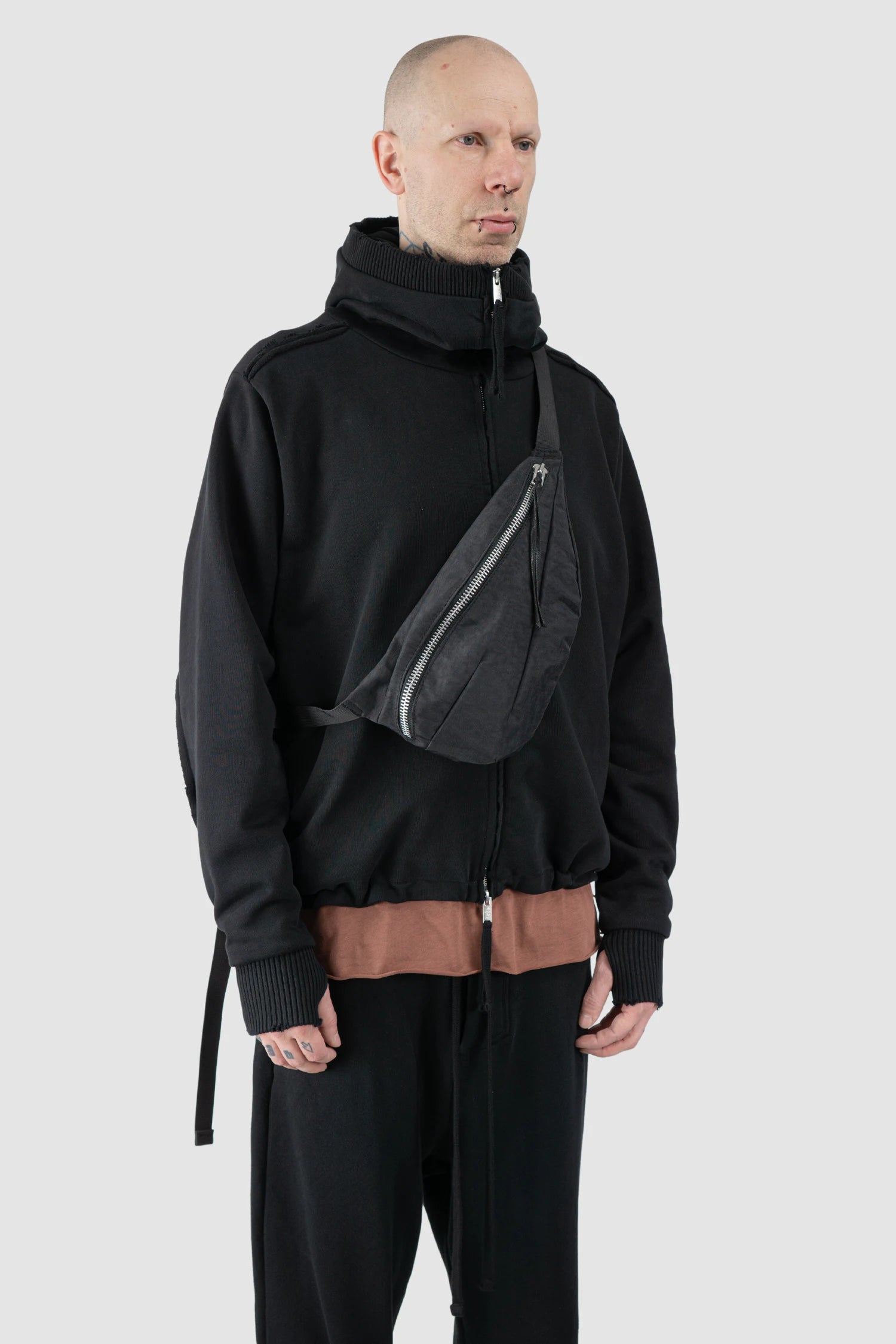 Werkschwarz - model side view of men’s Black Cross Body Waist Bag Nylon 1