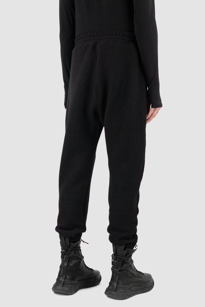 Back view of Black Woolen Sweatpants for Men with elastic waistband and recycled wool, FW23, NOMEN NESCIO